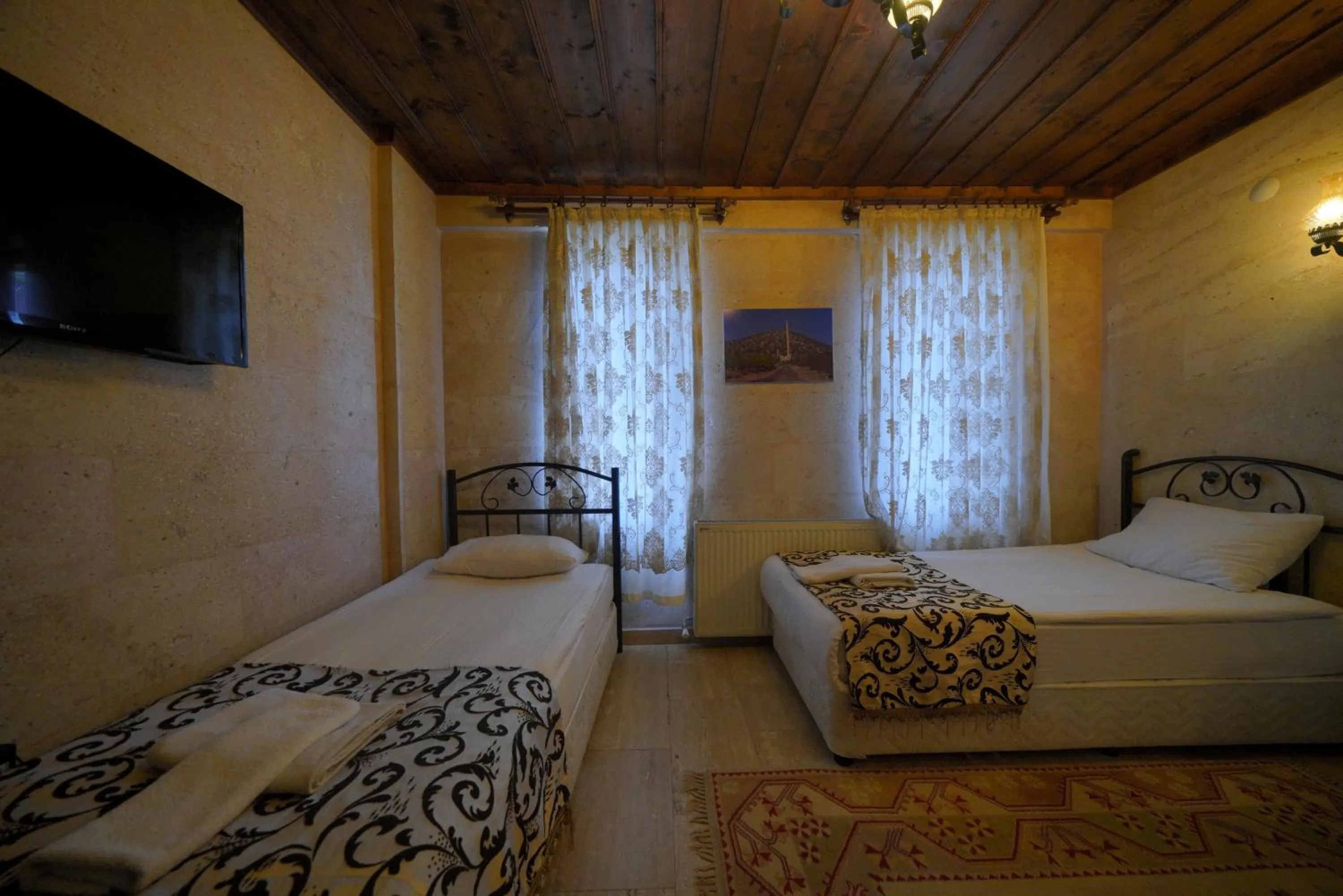 Bed in Goreme Cave Rooms&Pool