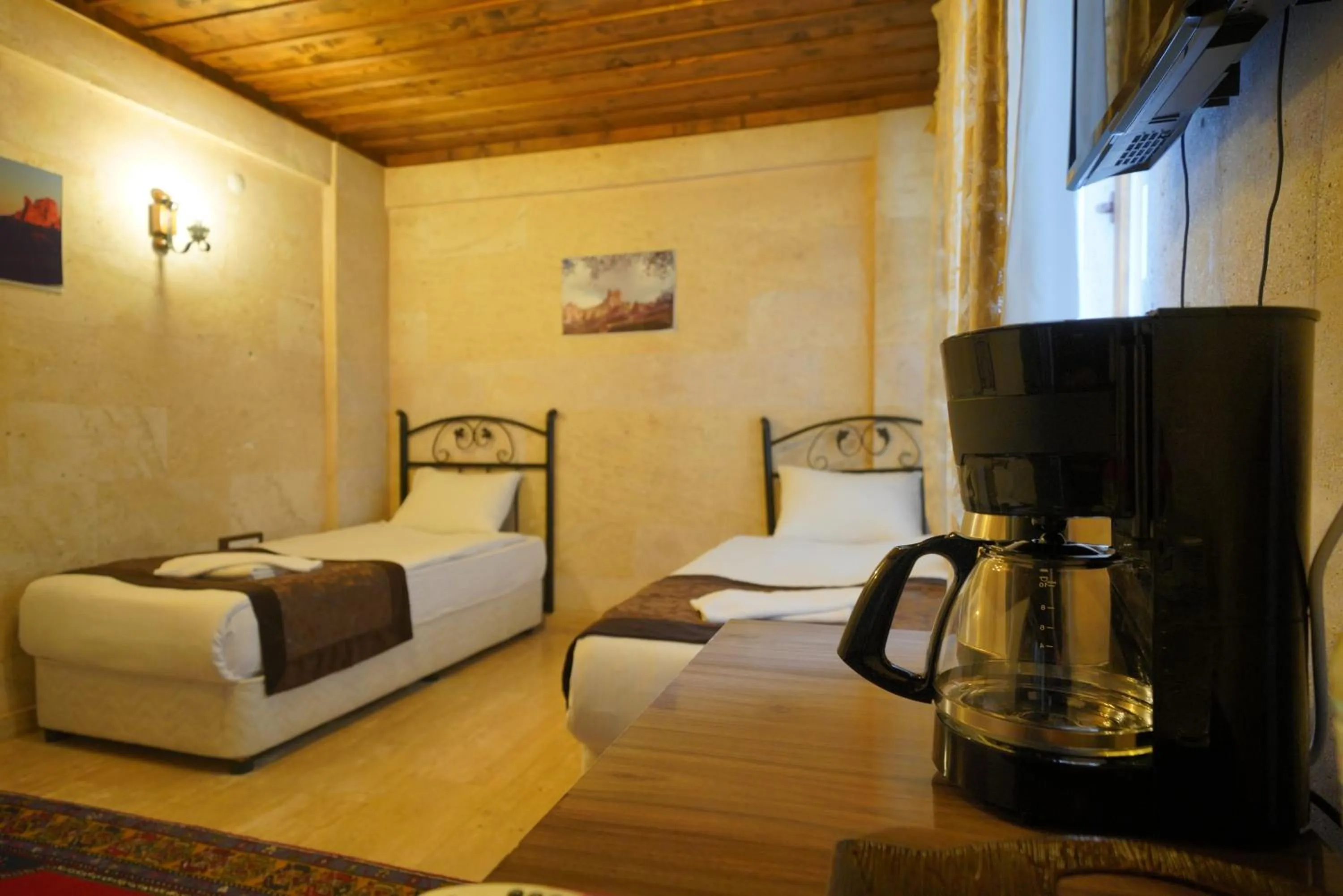 Bed in Goreme Cave Rooms&Pool