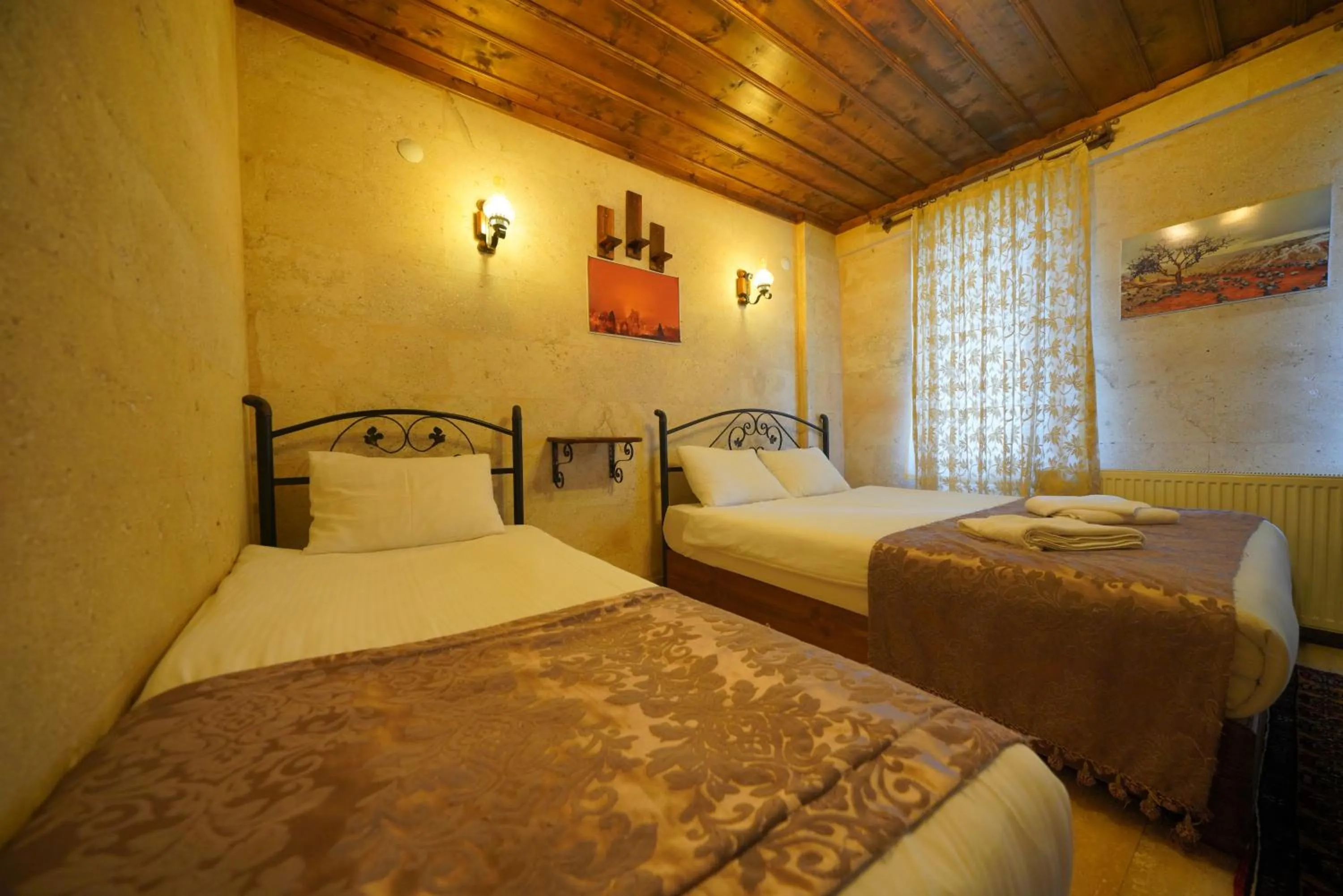 Bed in Goreme Cave Rooms&Pool