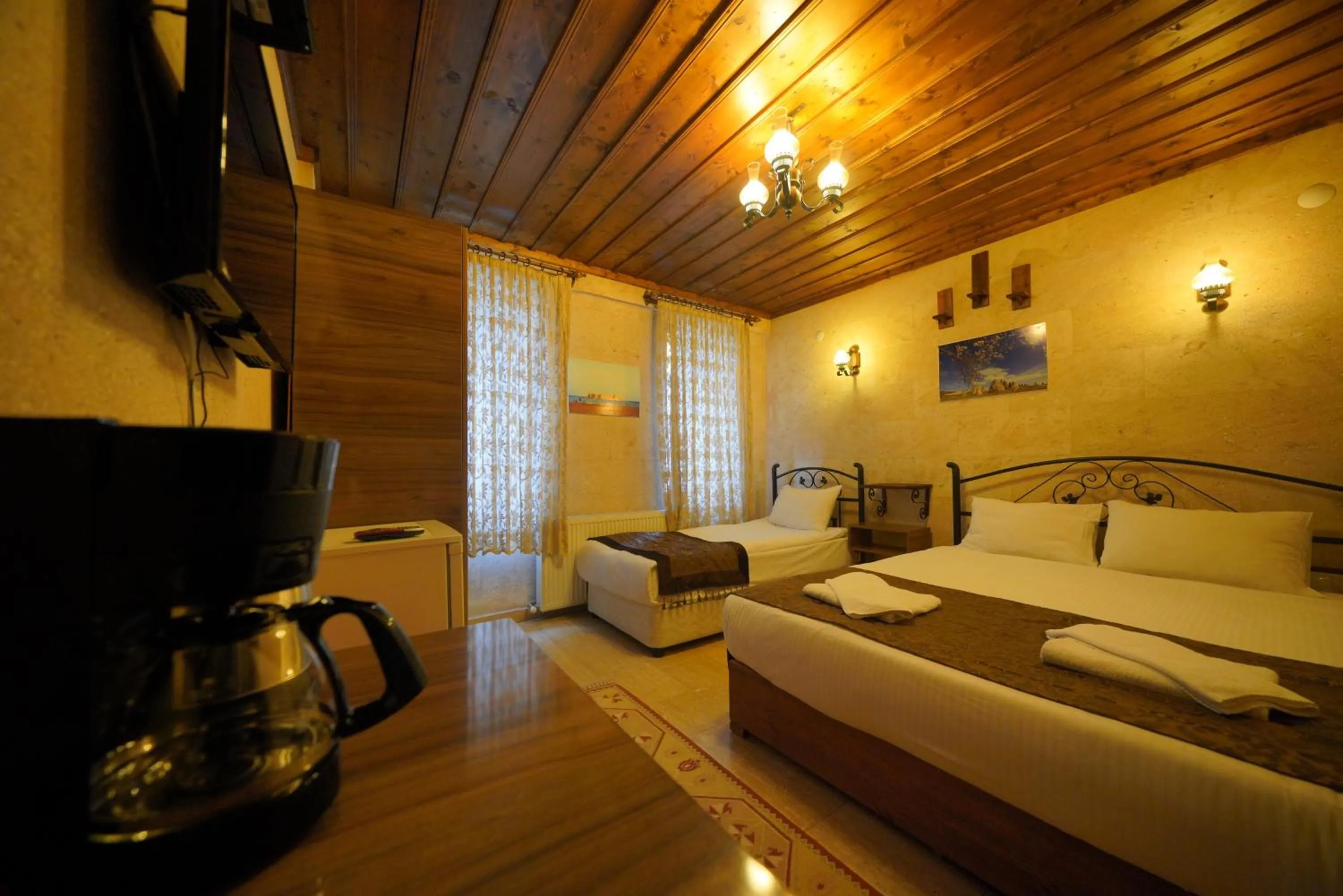 Bed in Goreme Cave Rooms&Pool