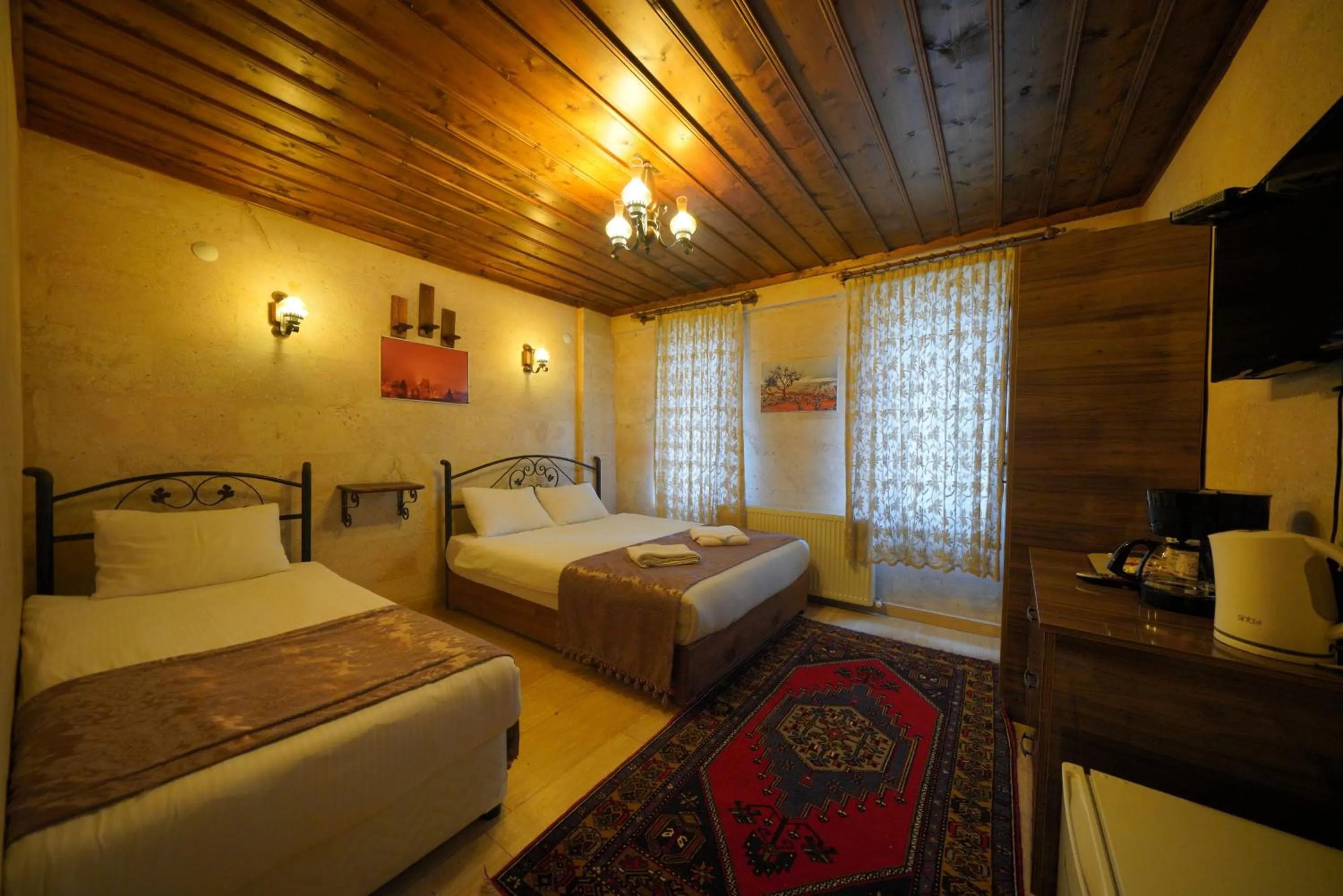 Bed in Goreme Cave Rooms&Pool