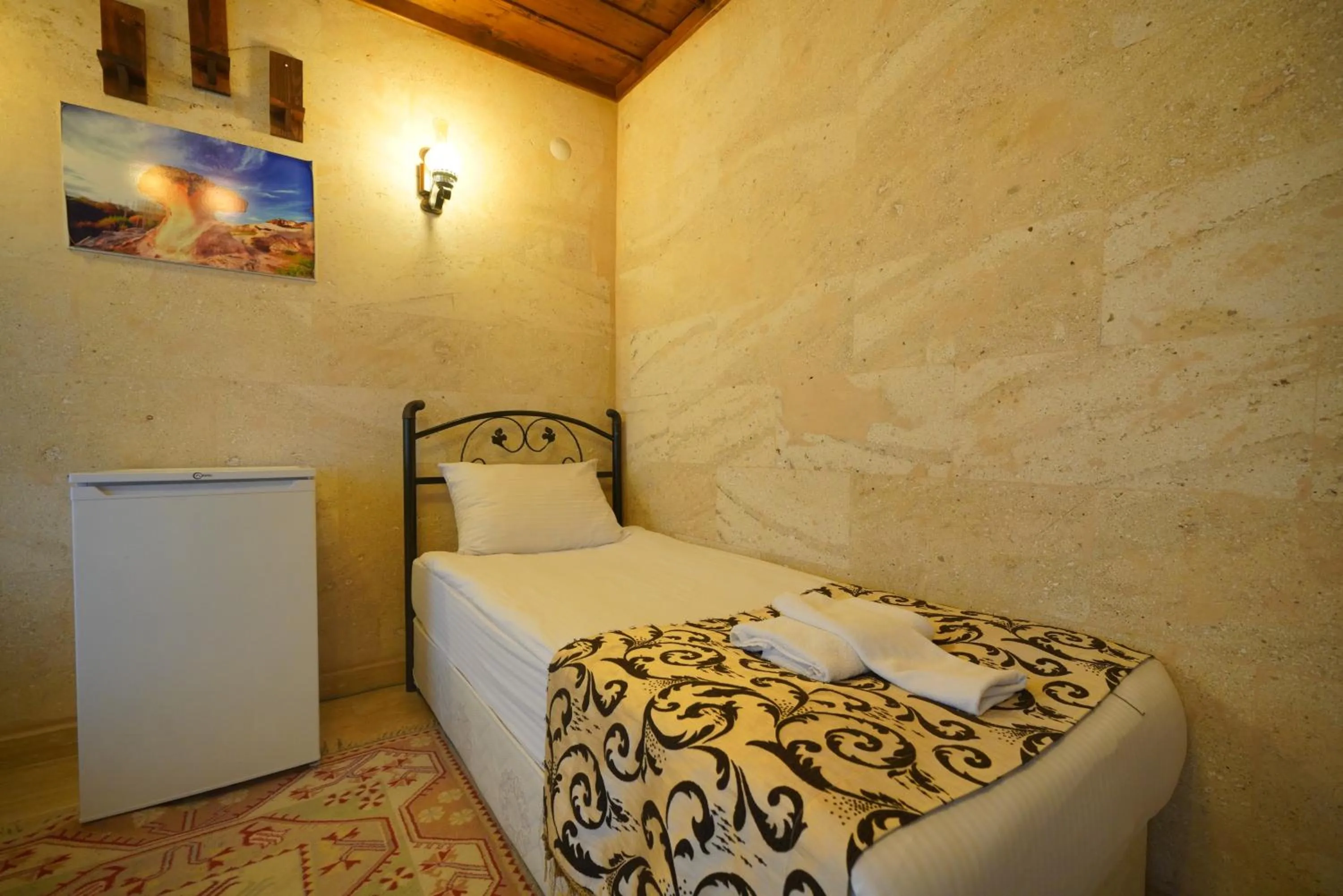 Bed in Goreme Cave Rooms&Pool