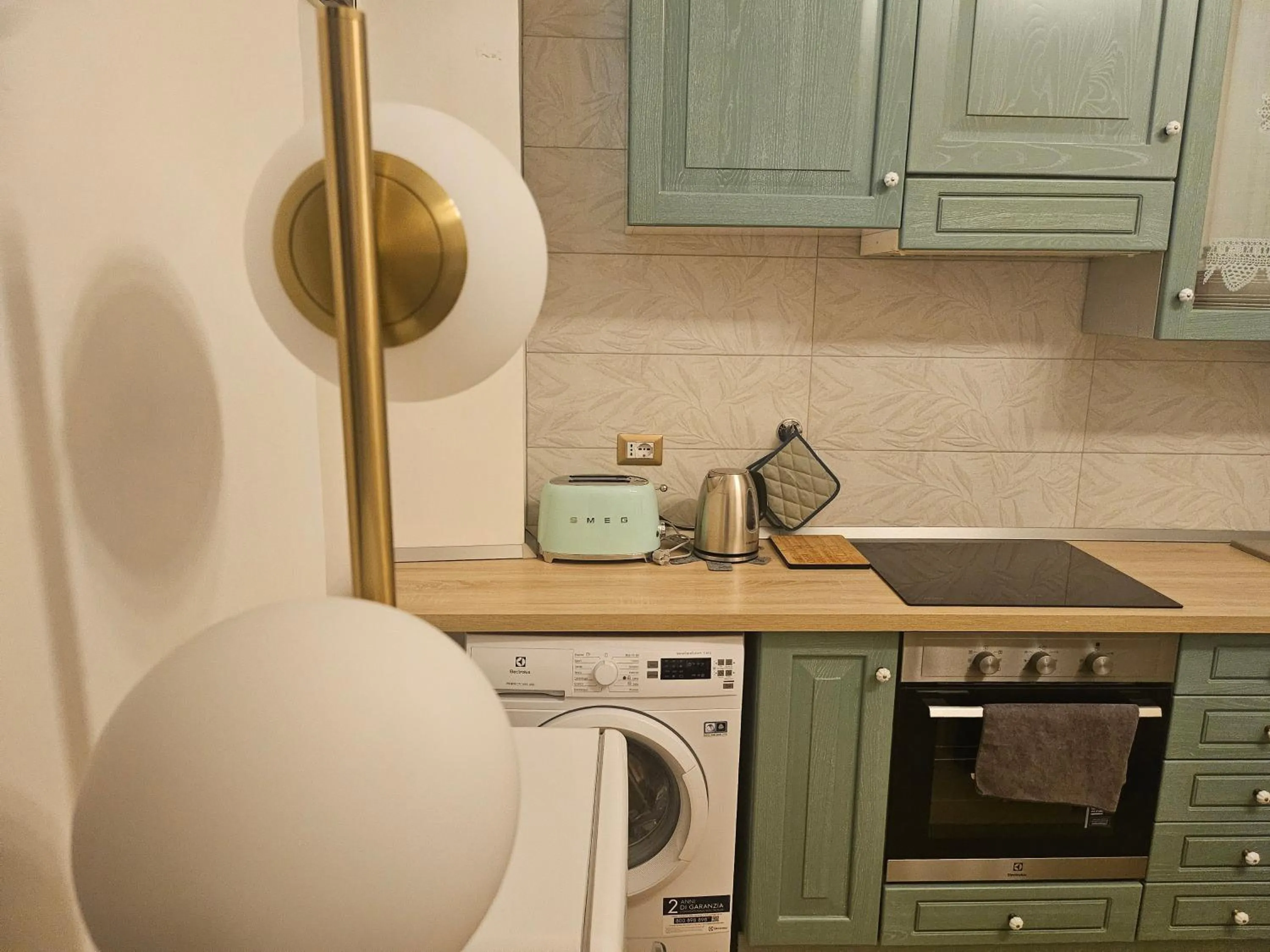 Kitchen or kitchenette in Merulana Suite Apartment