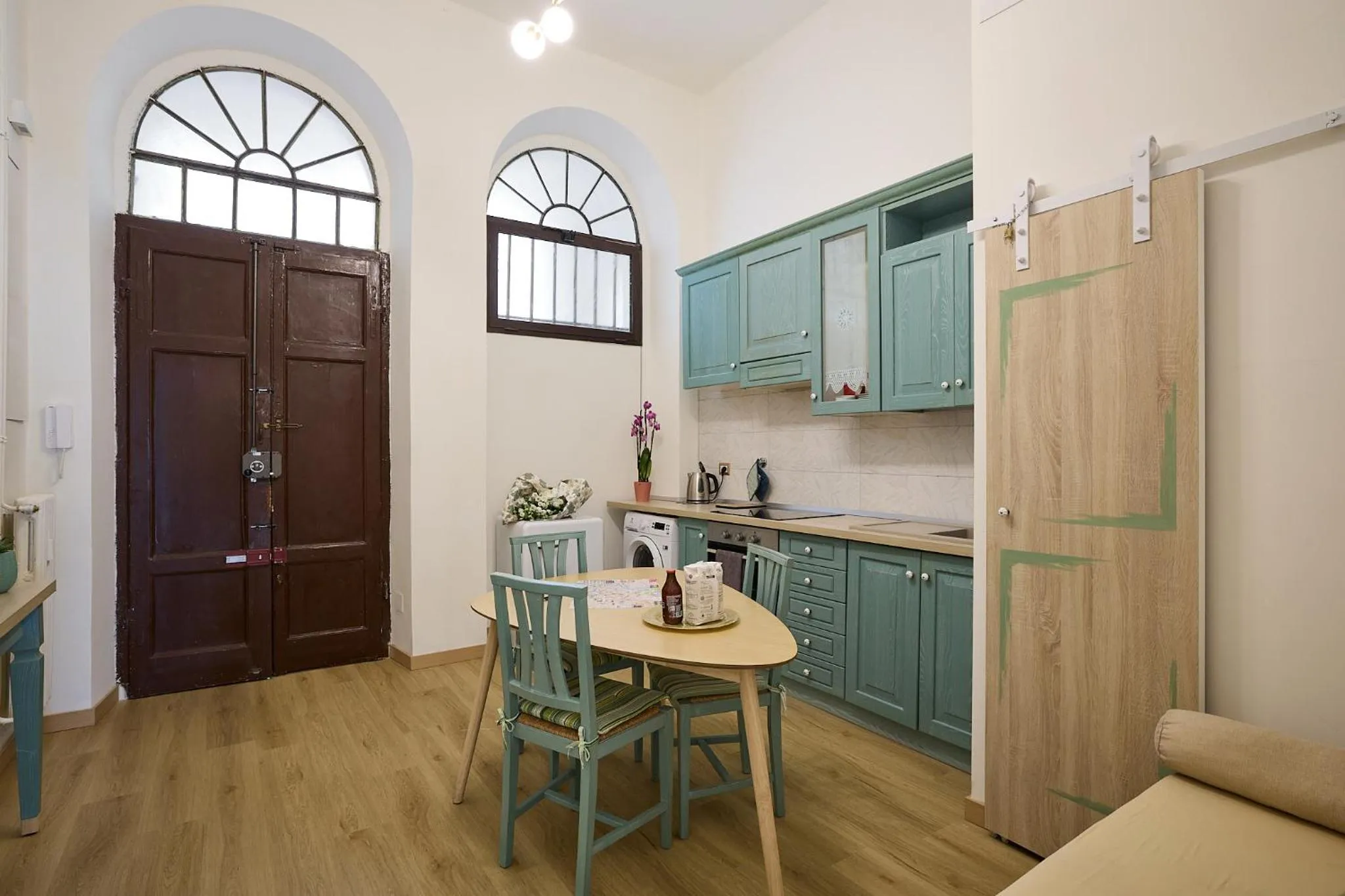 Kitchen or kitchenette in Merulana Suite Apartment