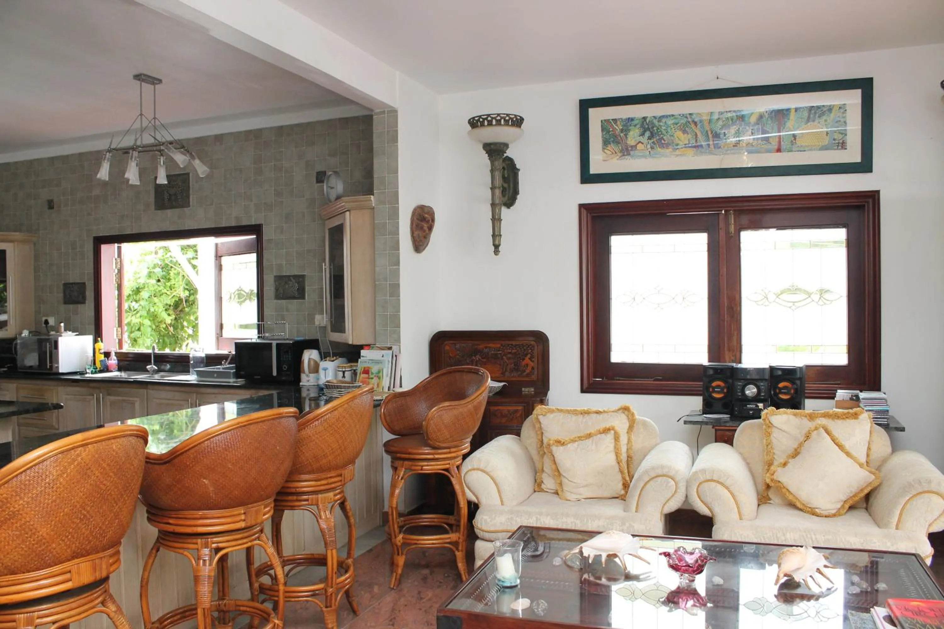 Communal lounge/ TV room in Le Bonheur Villa