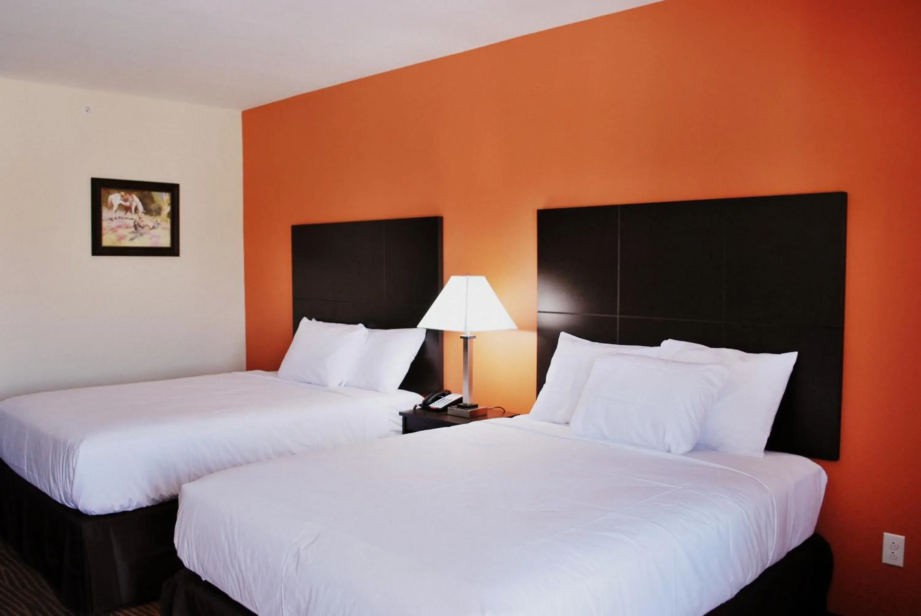 Bedroom in Westwood Inn & Suites Bedroom in Westwood Inn & Suites