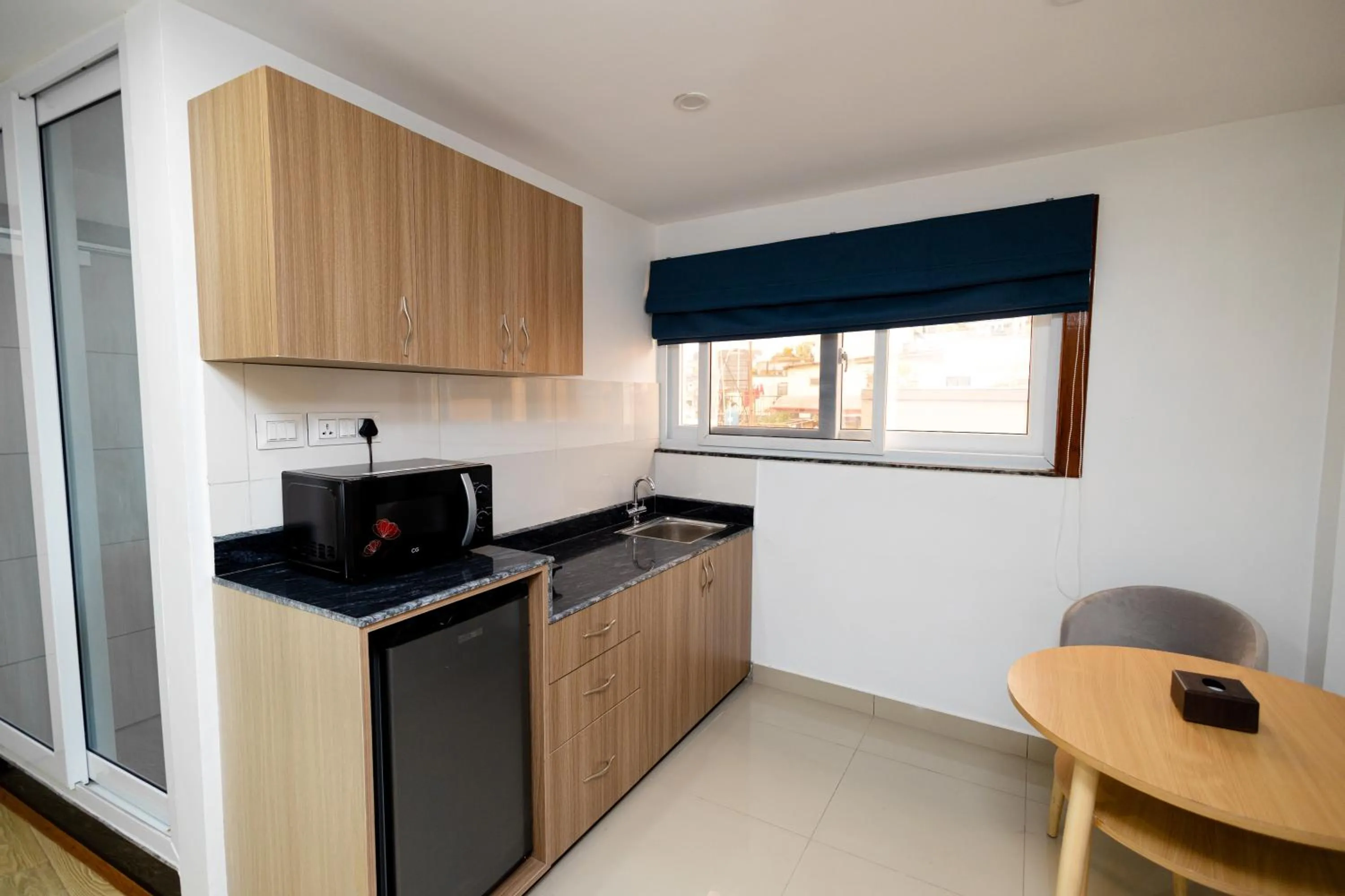 Kitchen or kitchenette in SRK Service Apartment And Hotel