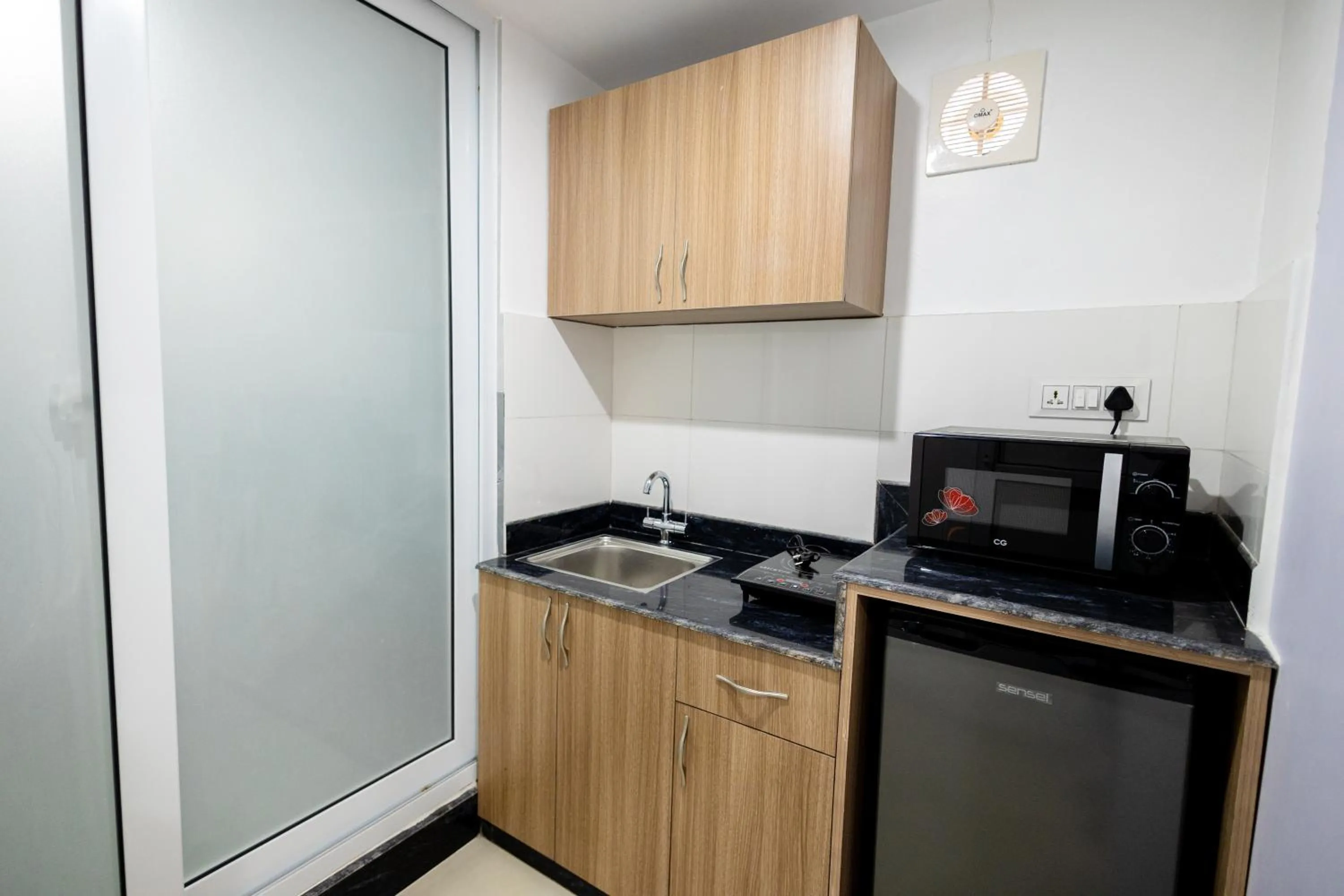 Kitchen or kitchenette in SRK Service Apartment And Hotel