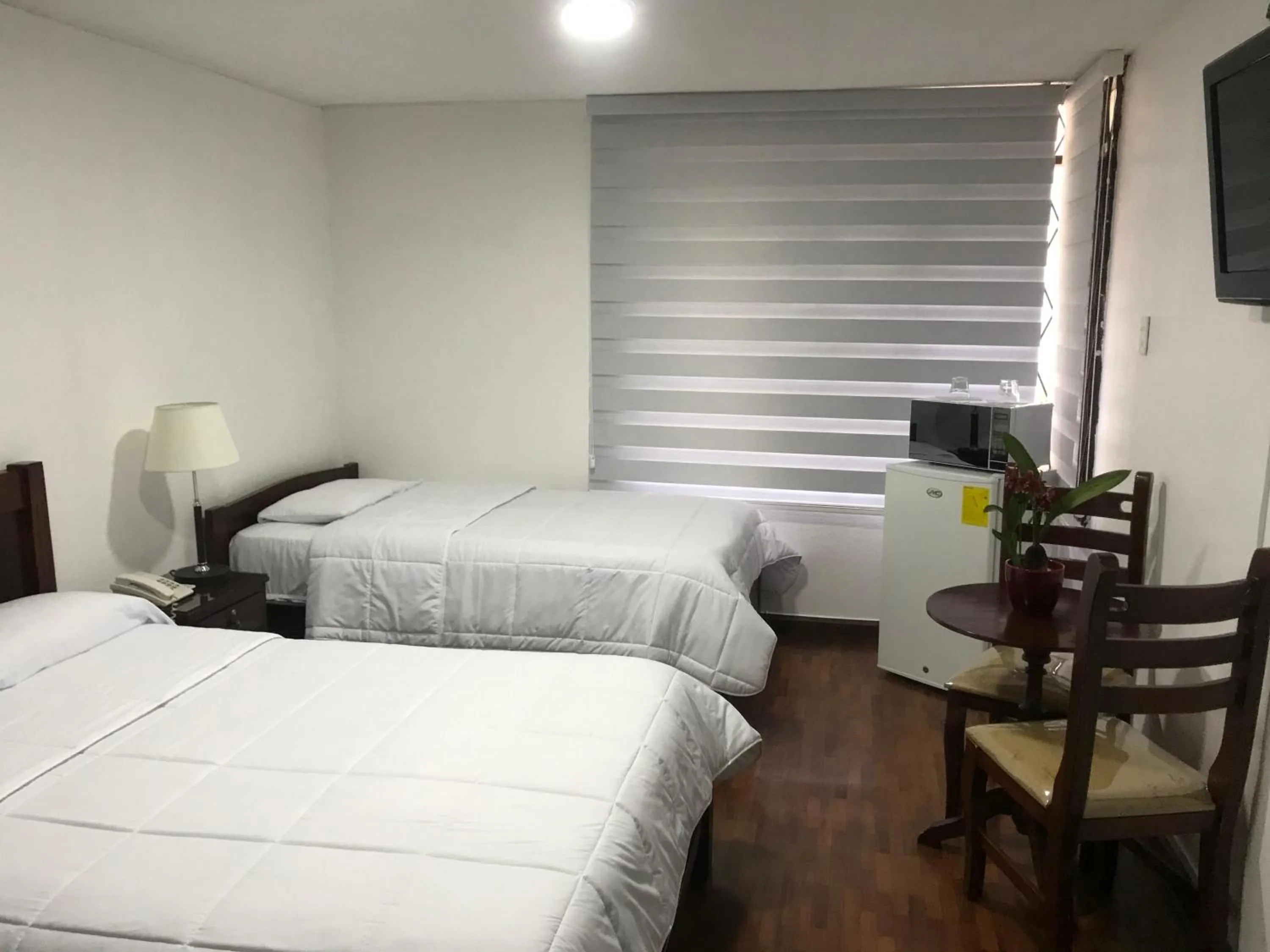 Bed in Altura Rooms & Suites