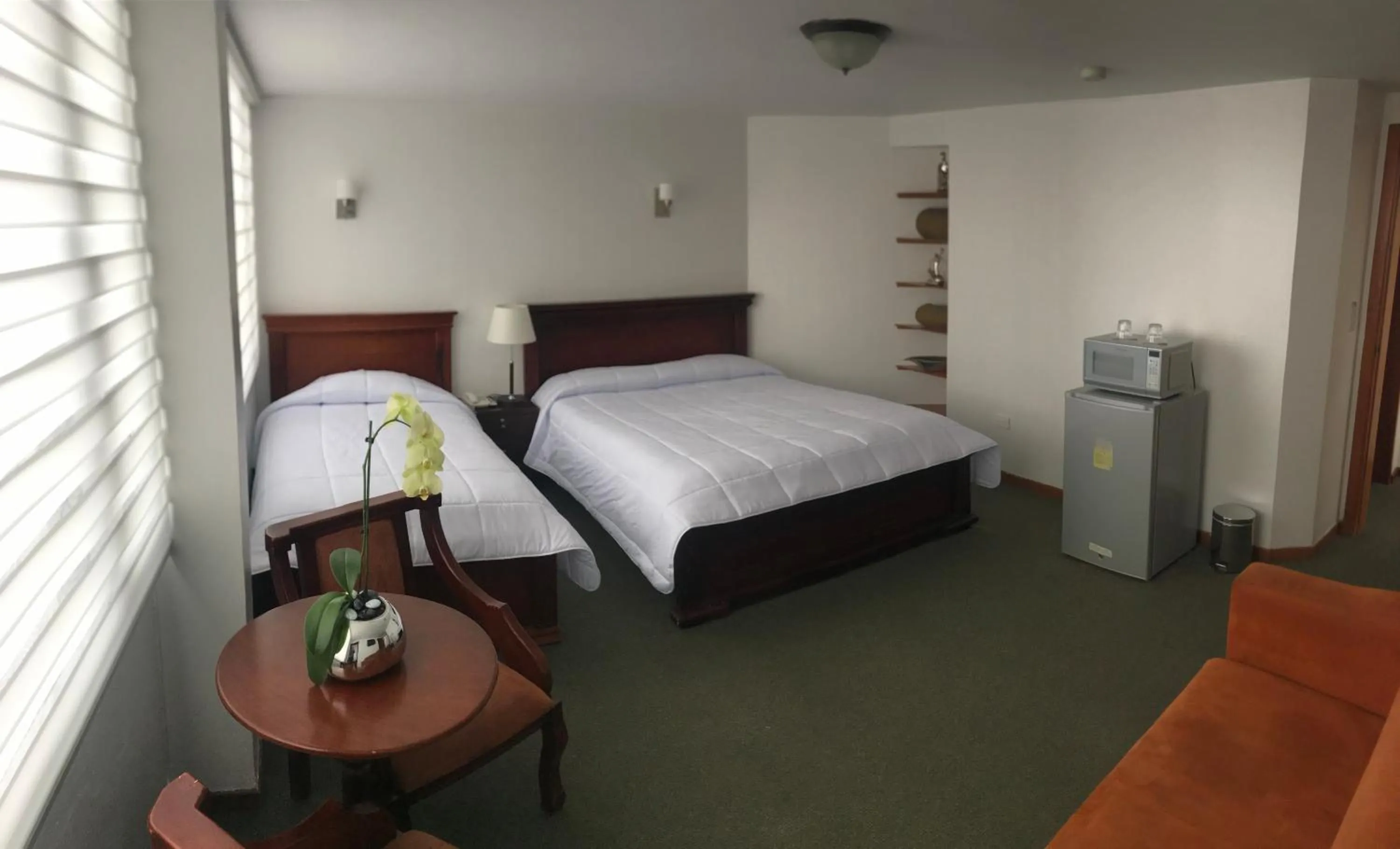 Bed in Altura Rooms & Suites