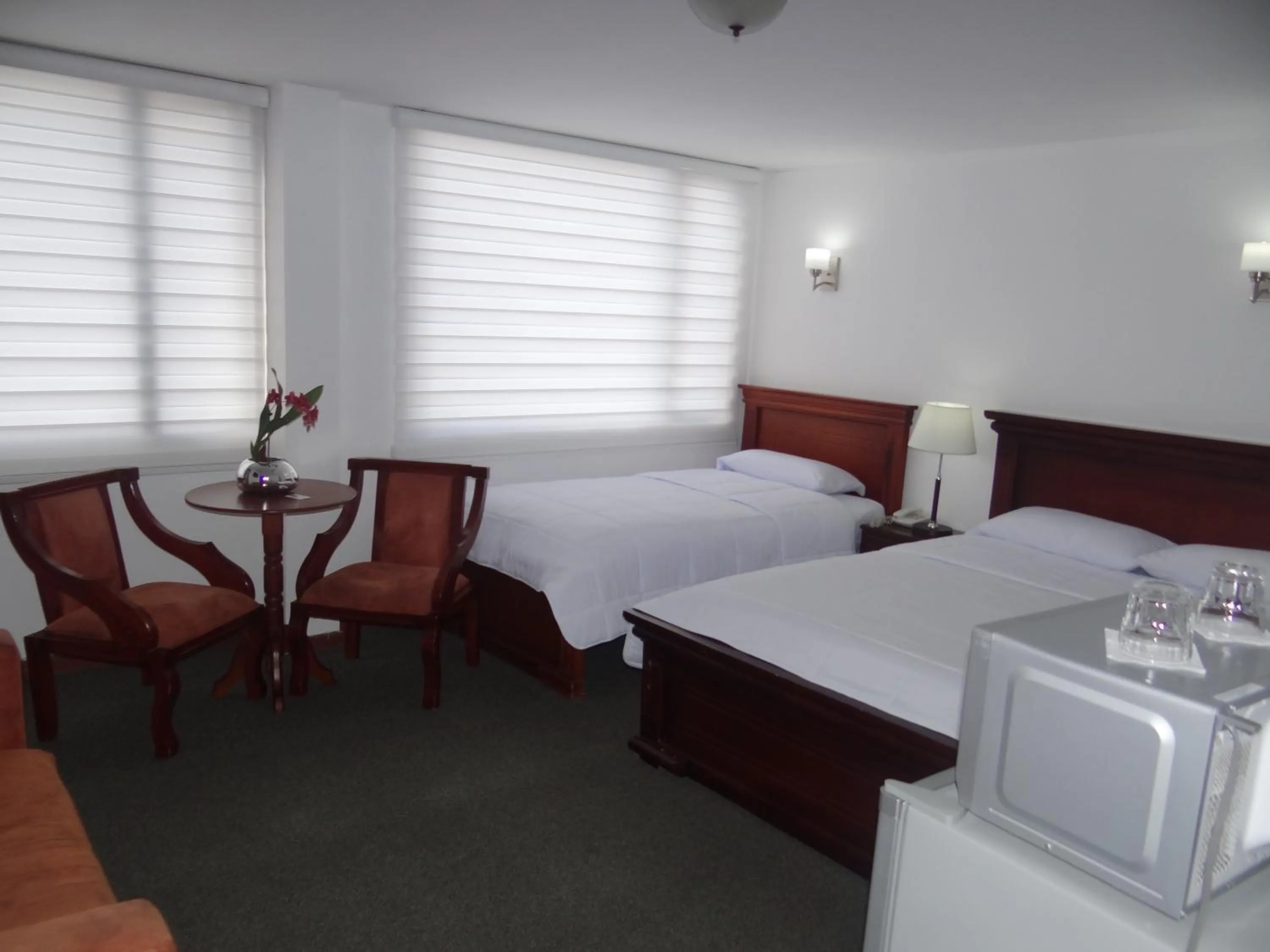Bed in Altura Rooms & Suites