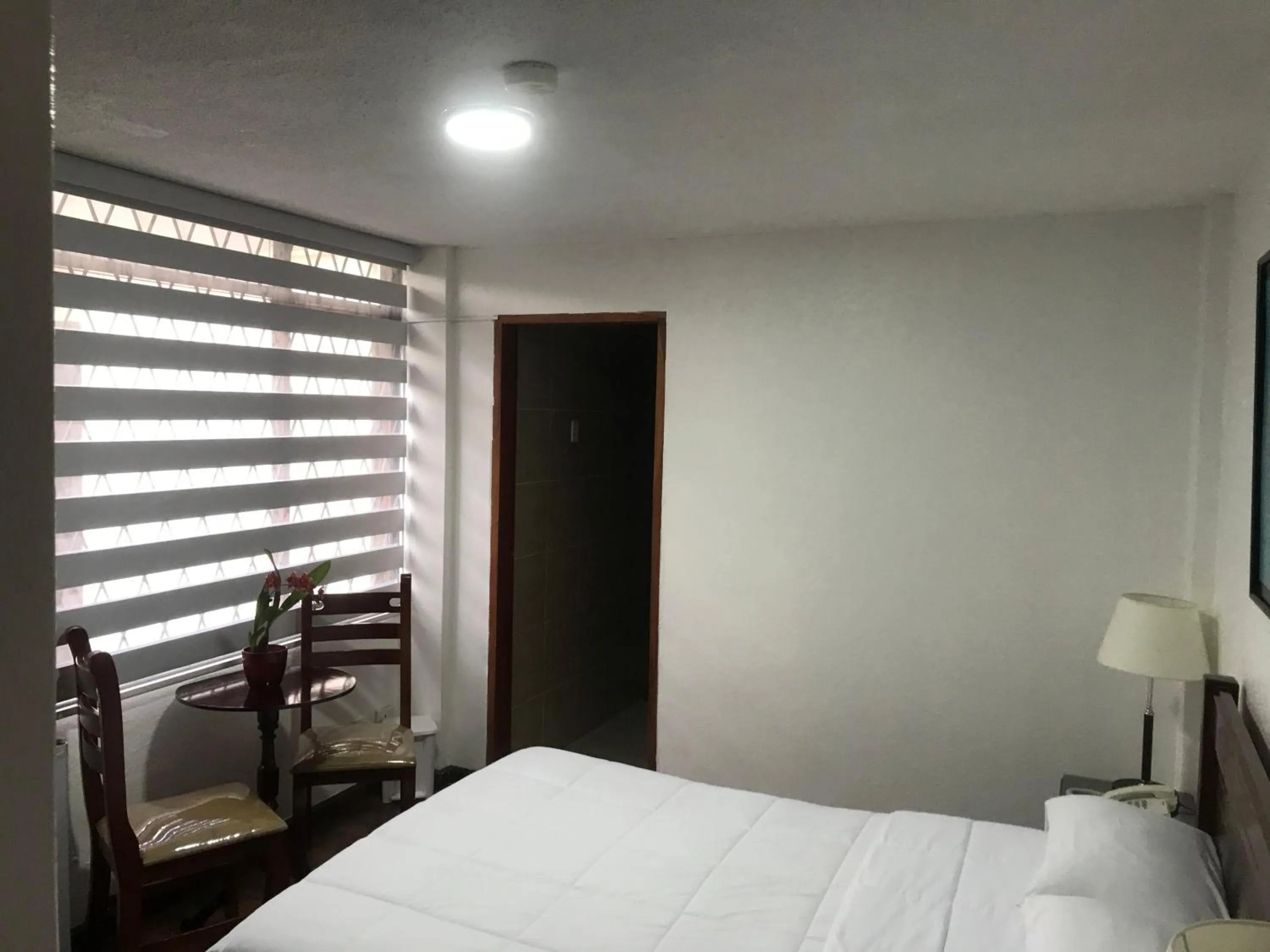 Bed in Altura Rooms & Suites