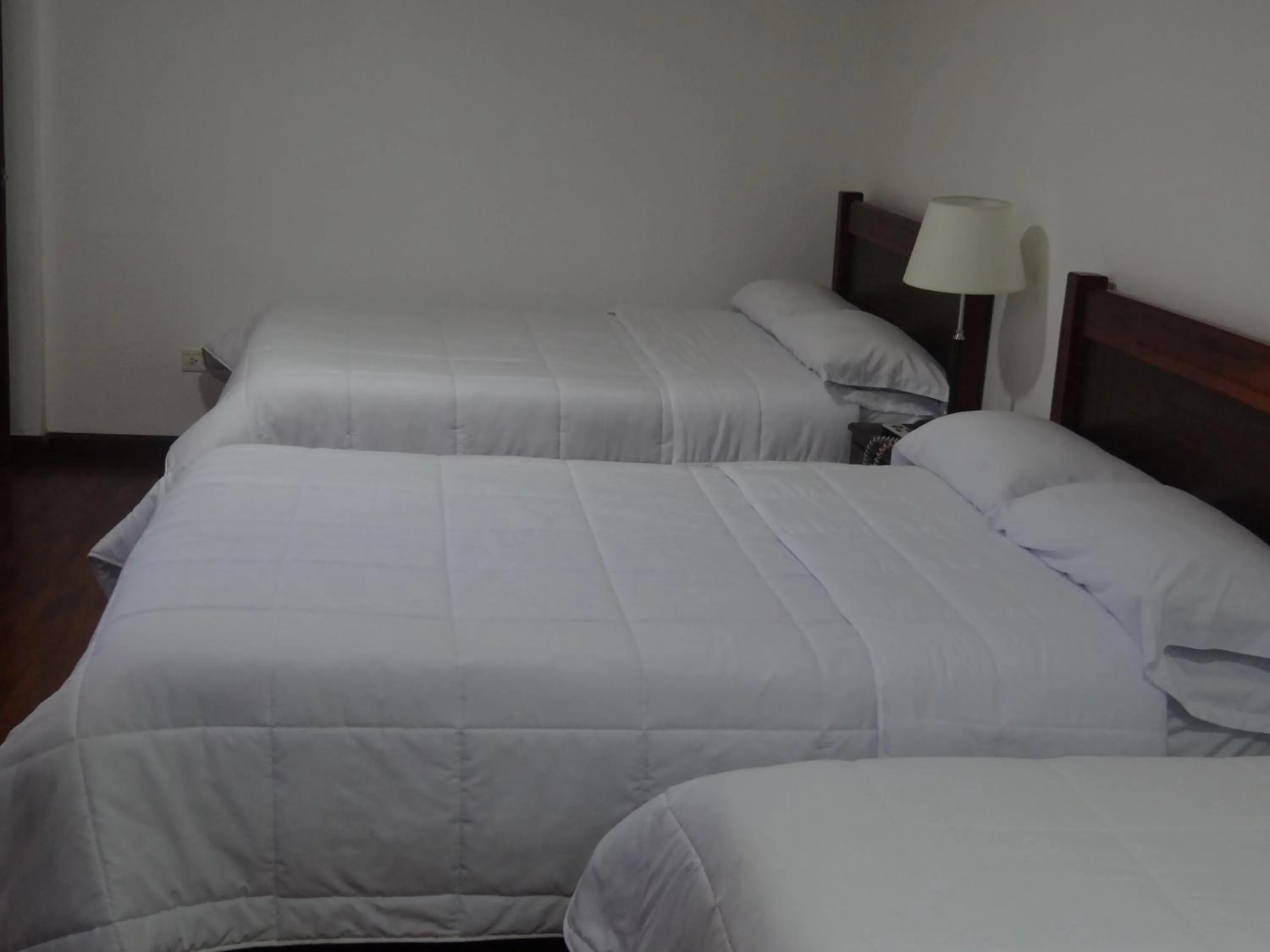 Bed in Altura Rooms & Suites