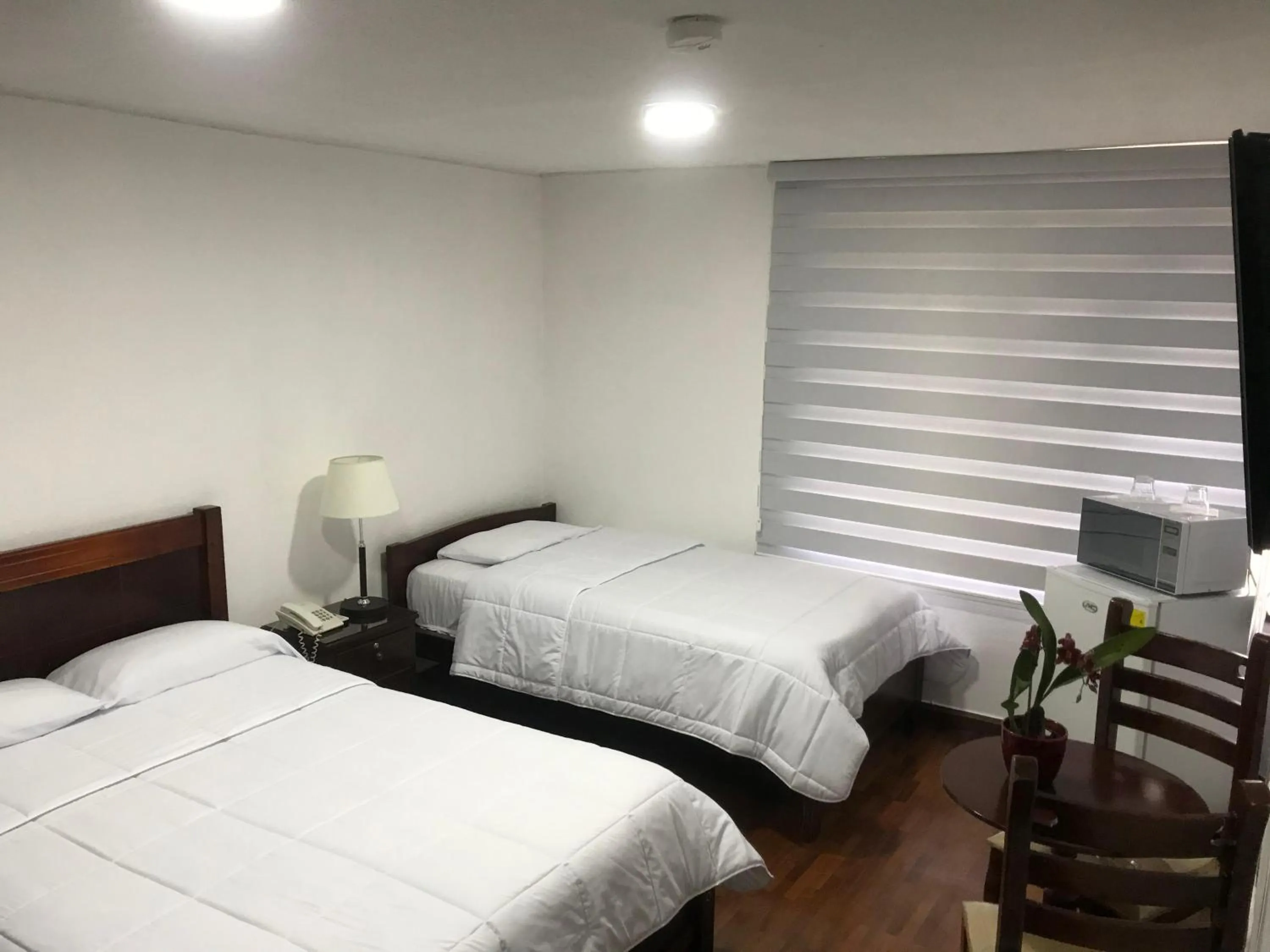 Bed in Altura Rooms & Suites