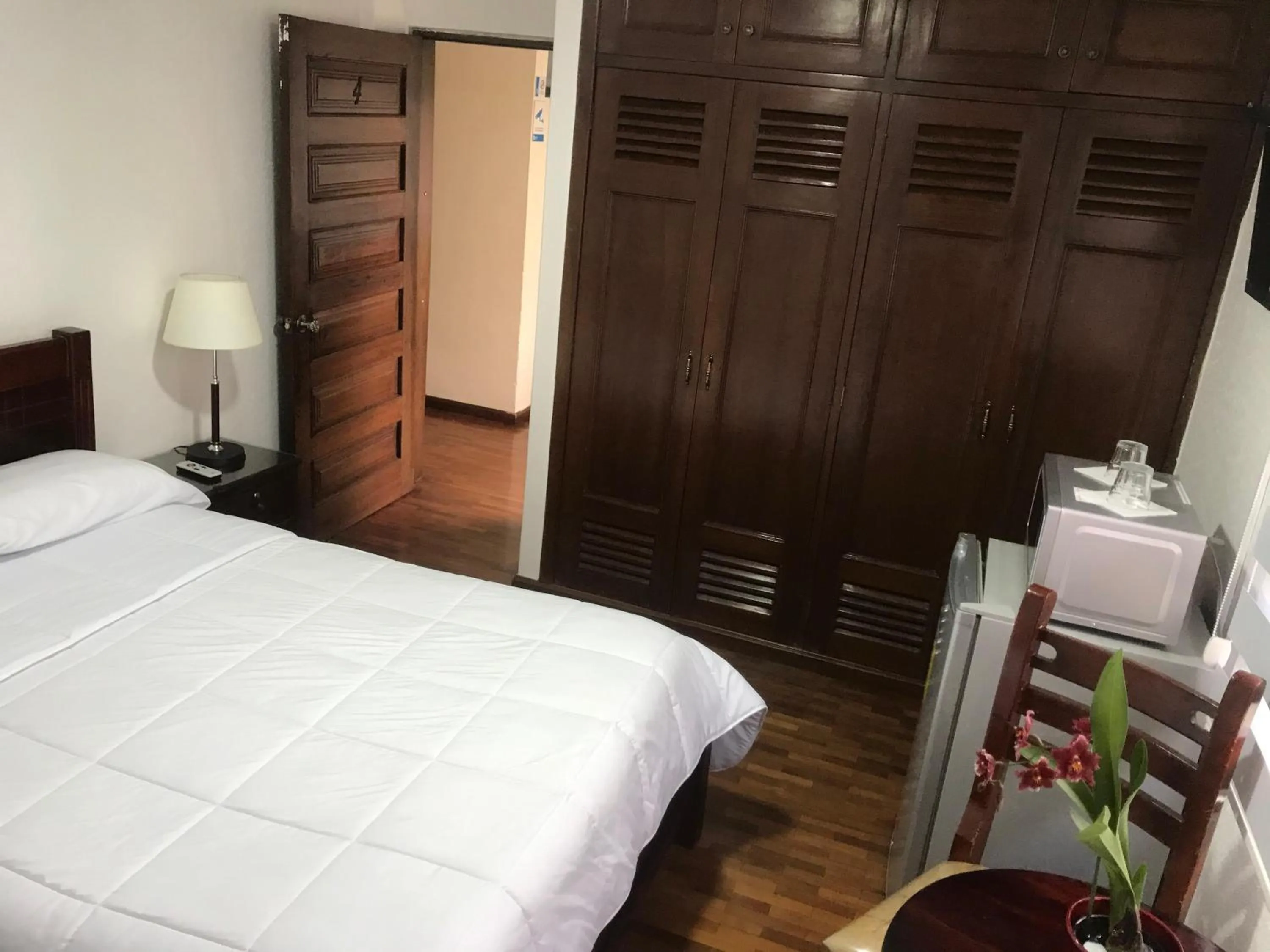 Bed in Altura Rooms & Suites