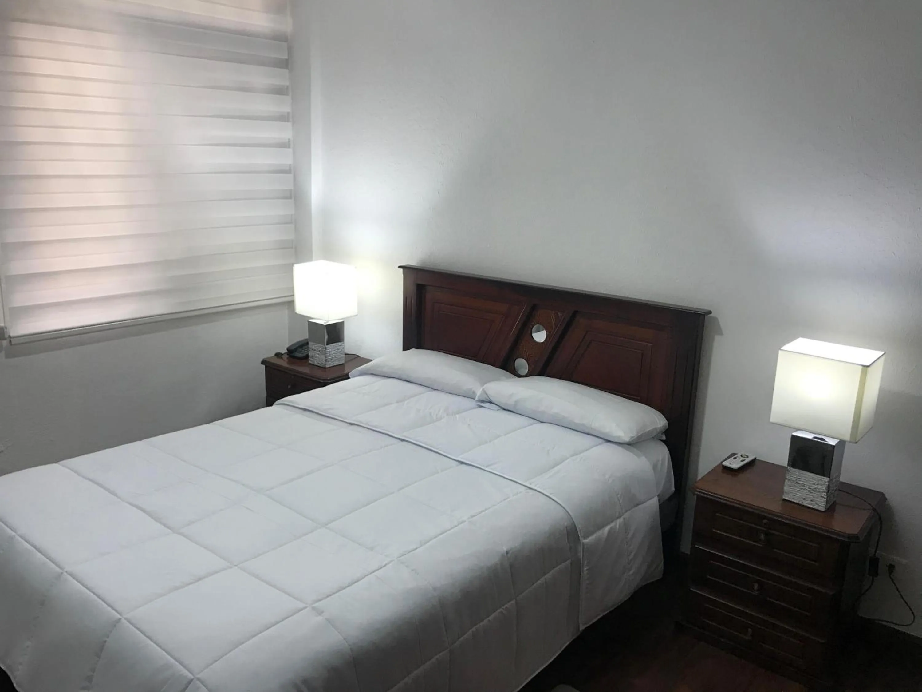 Bed in Altura Rooms & Suites