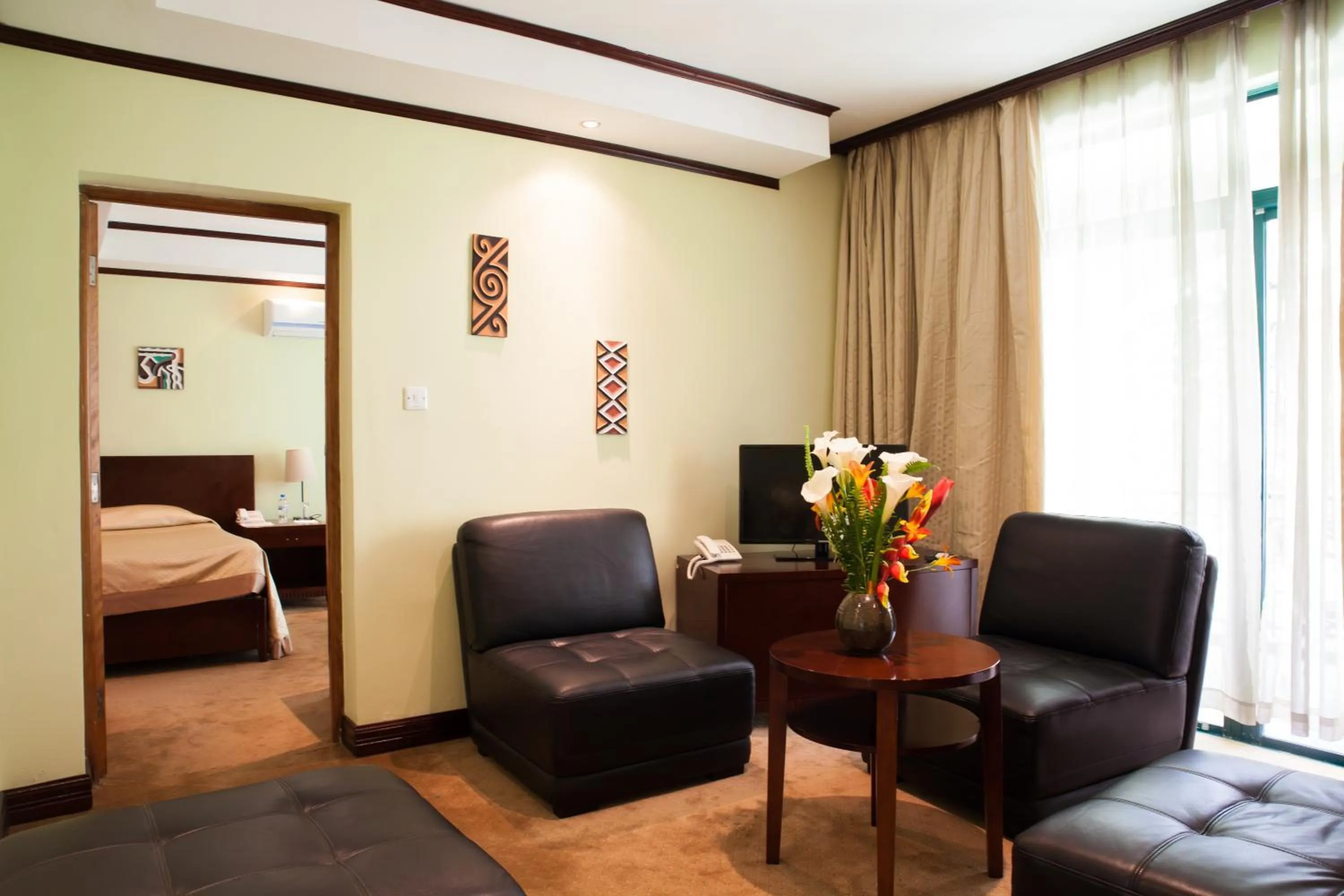 Living room, Bed in Gorillas Volcanoes Hotel