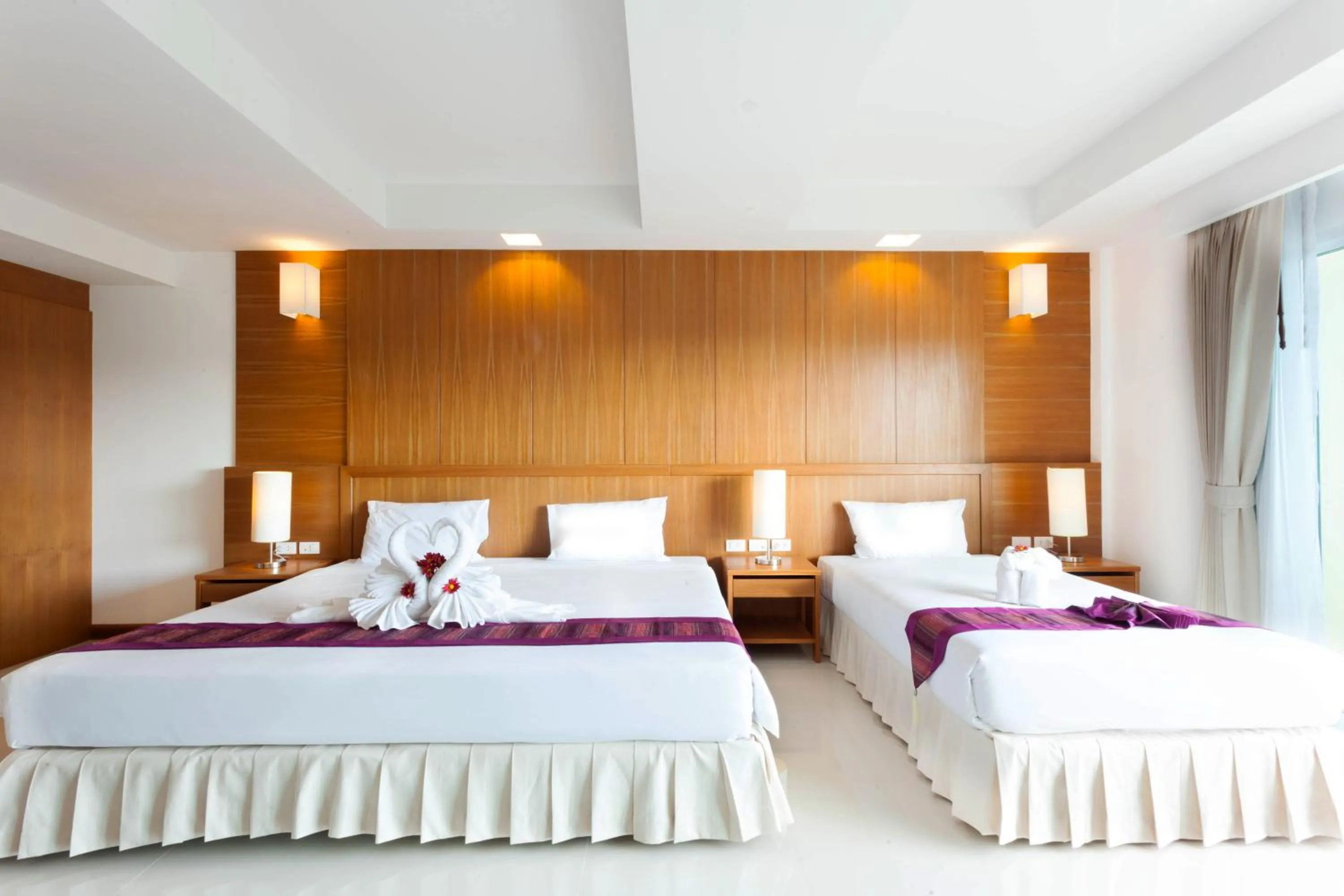 Bed in Rawai Princess Hotel