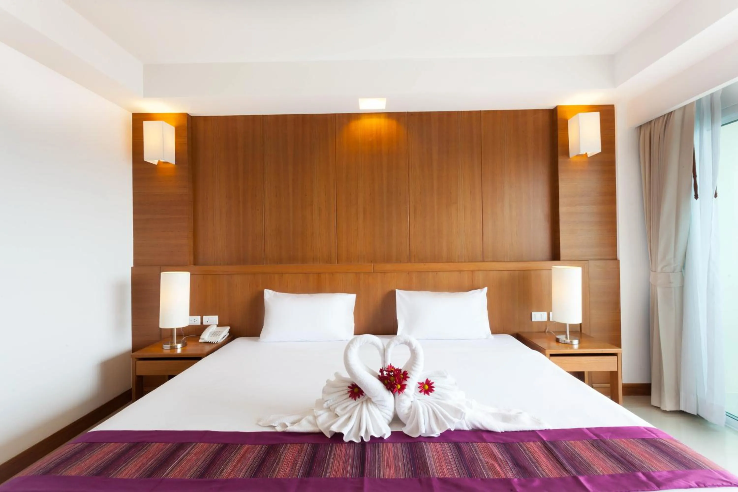 Bed in Rawai Princess Hotel