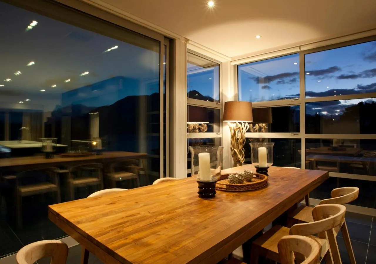 Dining area in Kakara Moana by MajorDomo - Lake Views & Spa Pool