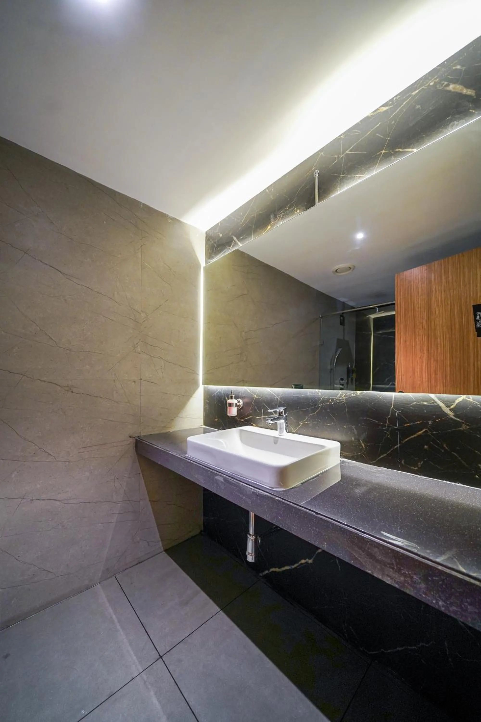 Bathroom in Olive Hotel Benz Circle, Vijayawada by Embassy Group