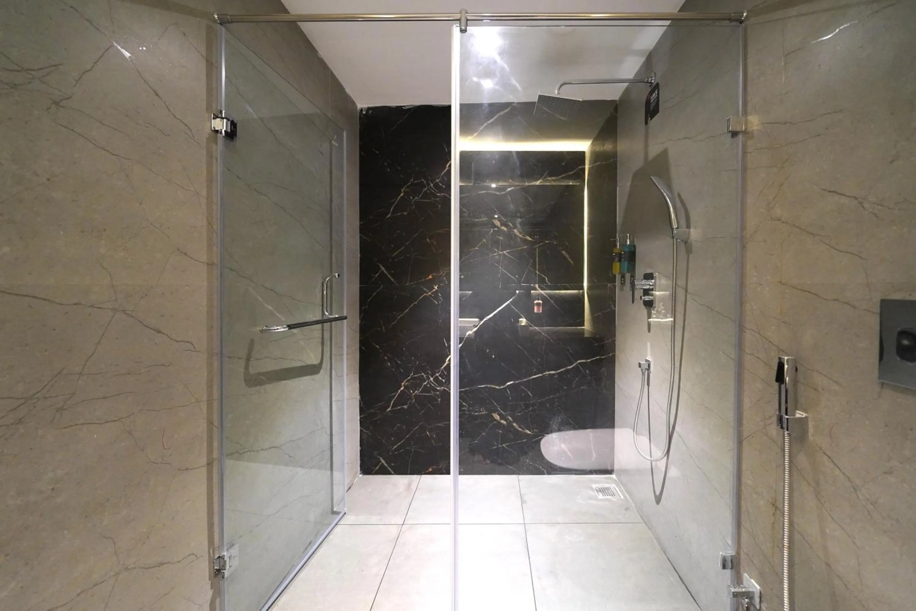 Bathroom in Olive Hotel Benz Circle, Vijayawada by Embassy Group