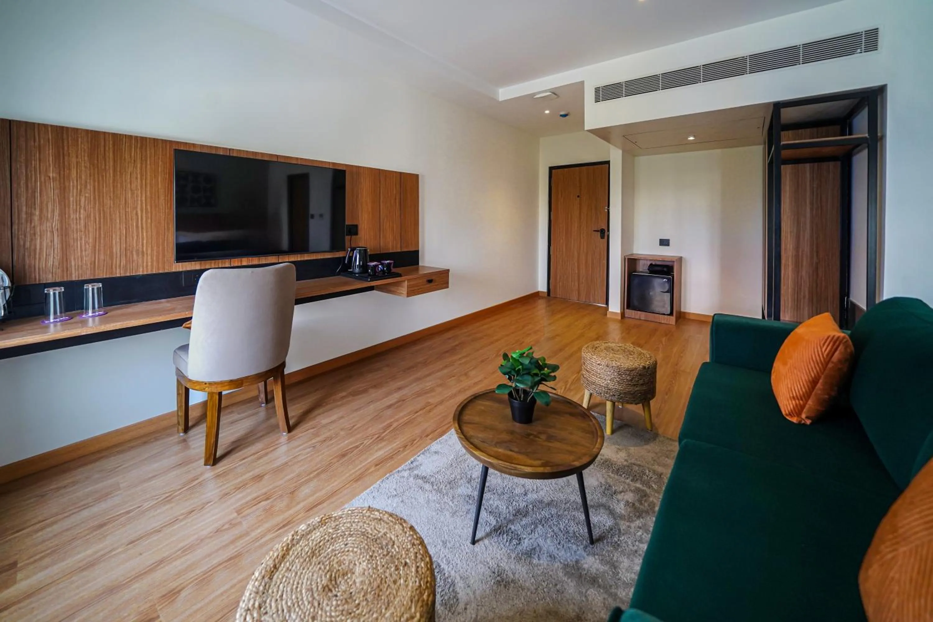 Communal lounge/ TV room in Olive Hotel Benz Circle, Vijayawada by Embassy Group