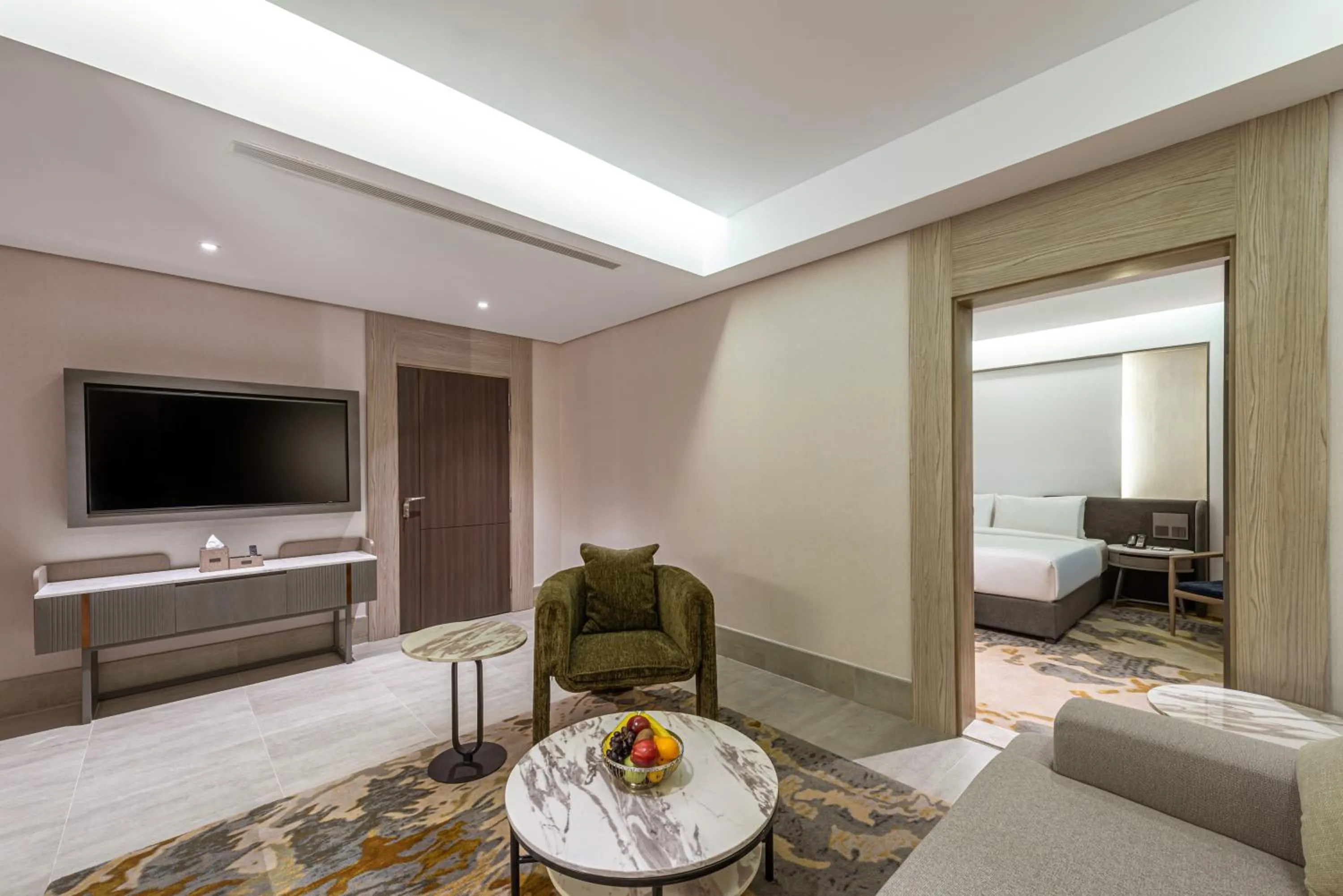 Communal lounge/ TV room, Bed in Grand Plaza Hotel - Tabuk