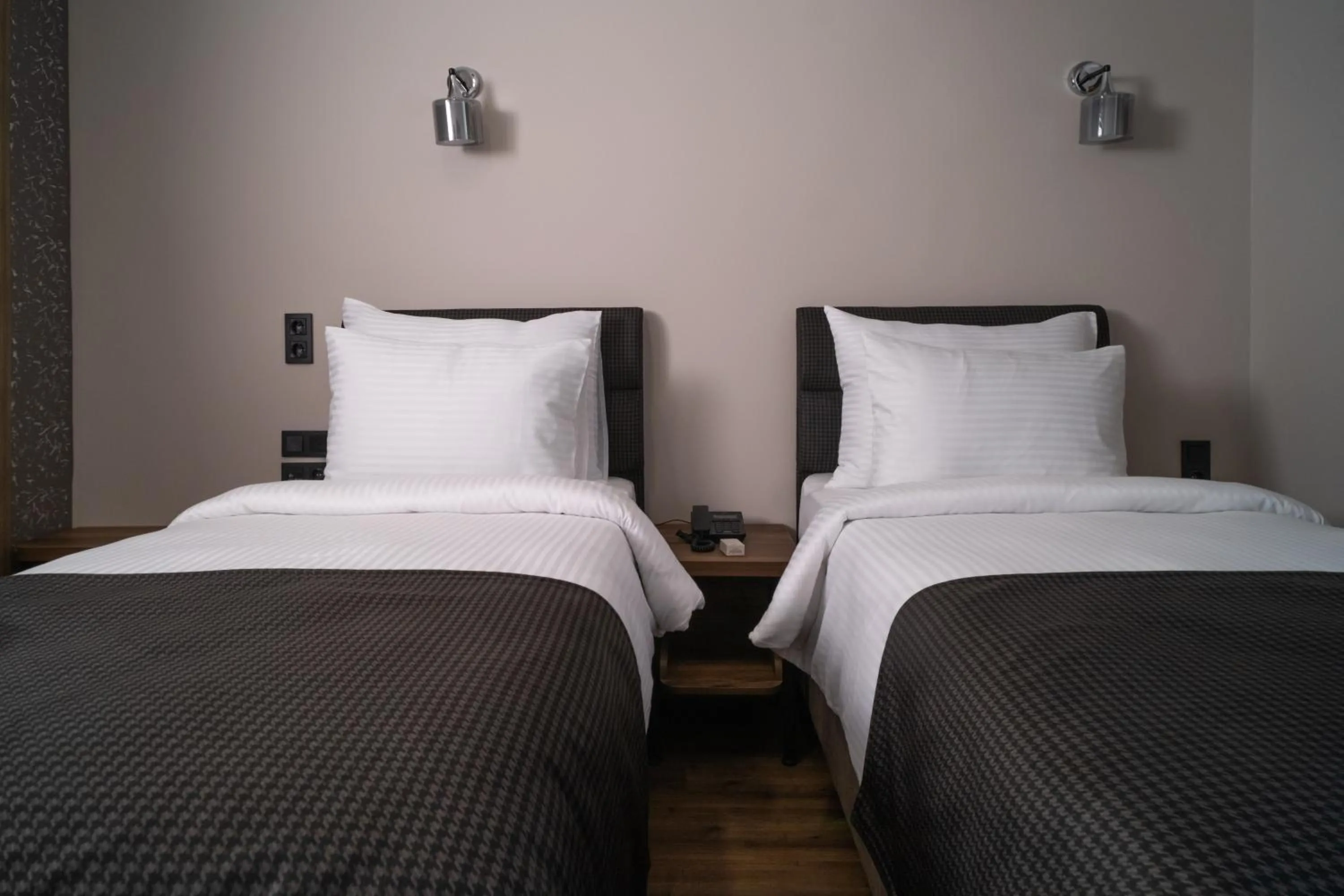 Bed in Grand CLOVER Hotel