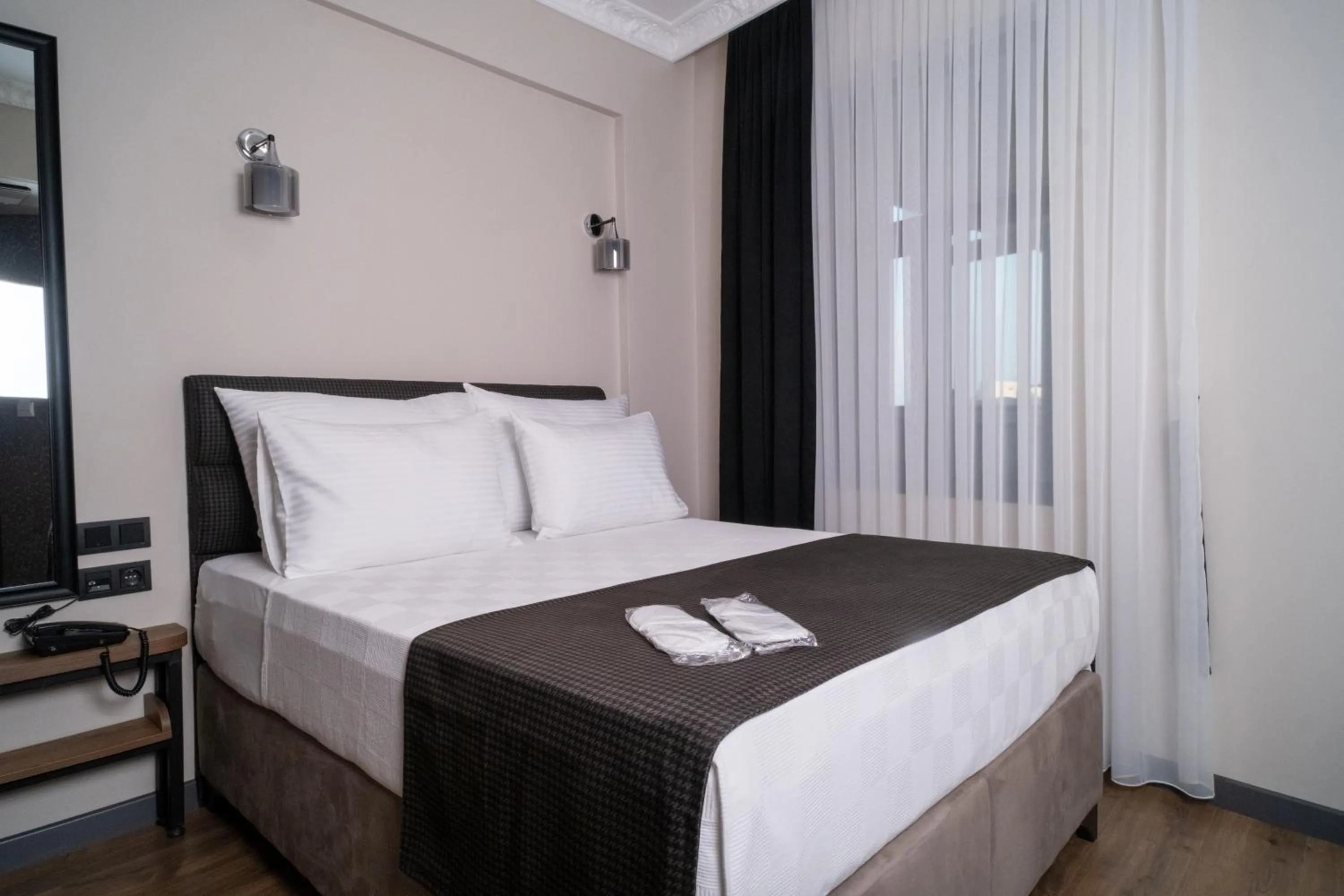 Bed in Grand CLOVER Hotel