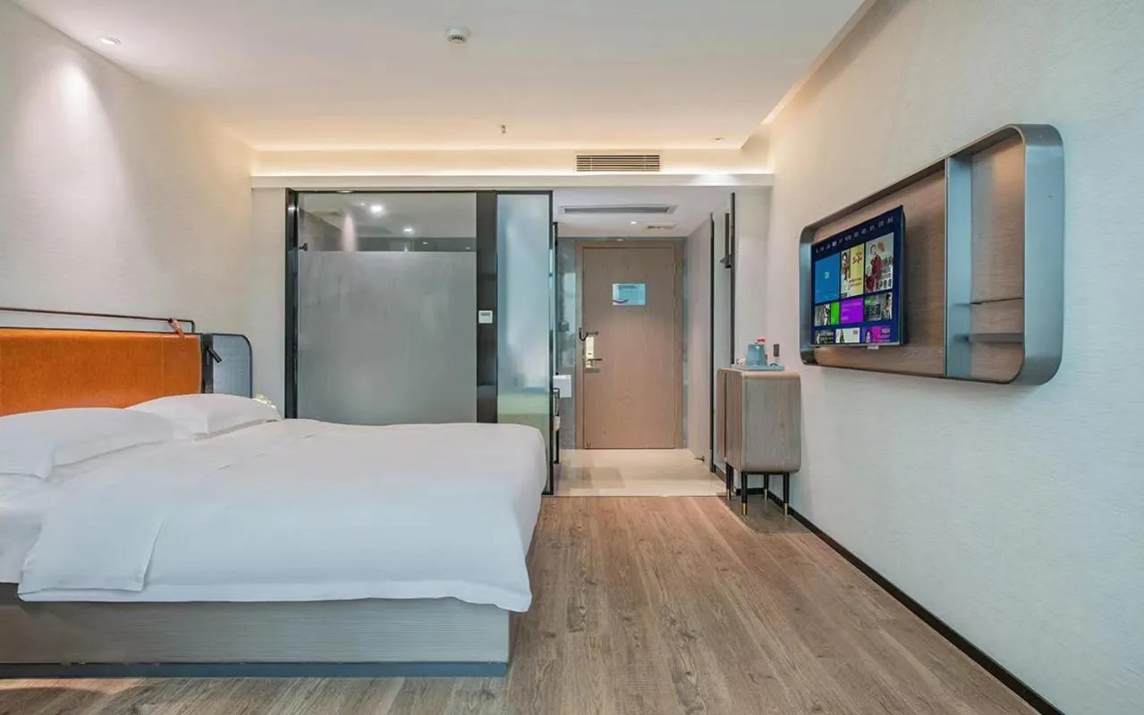 Bed in Echarm Hotel Guangzhou Jiahe Helong Branch