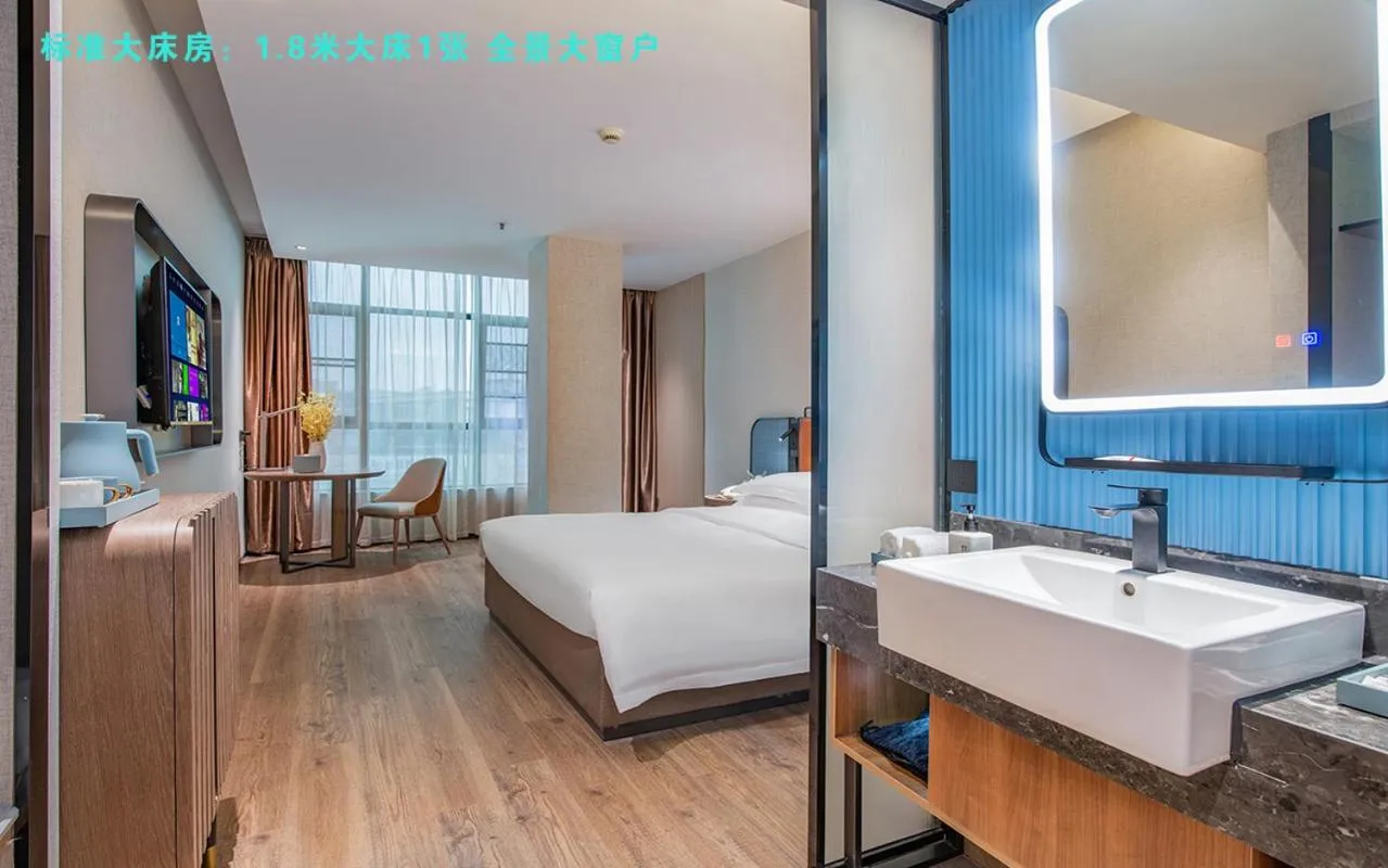 Bed in Echarm Hotel Guangzhou Jiahe Helong Branch