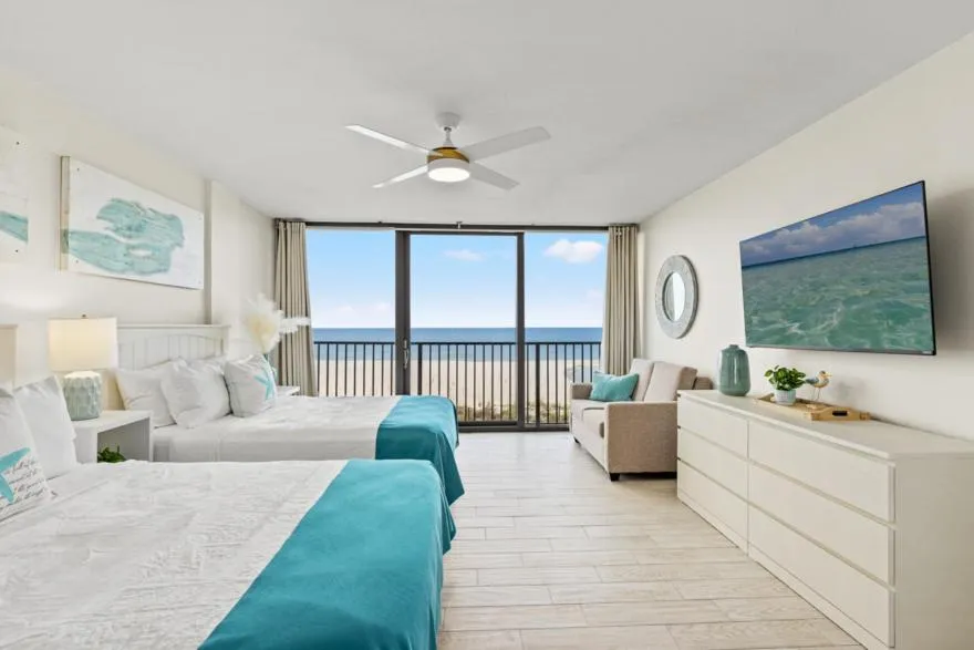 Bed in Sandpiper Beacon Beach Resort