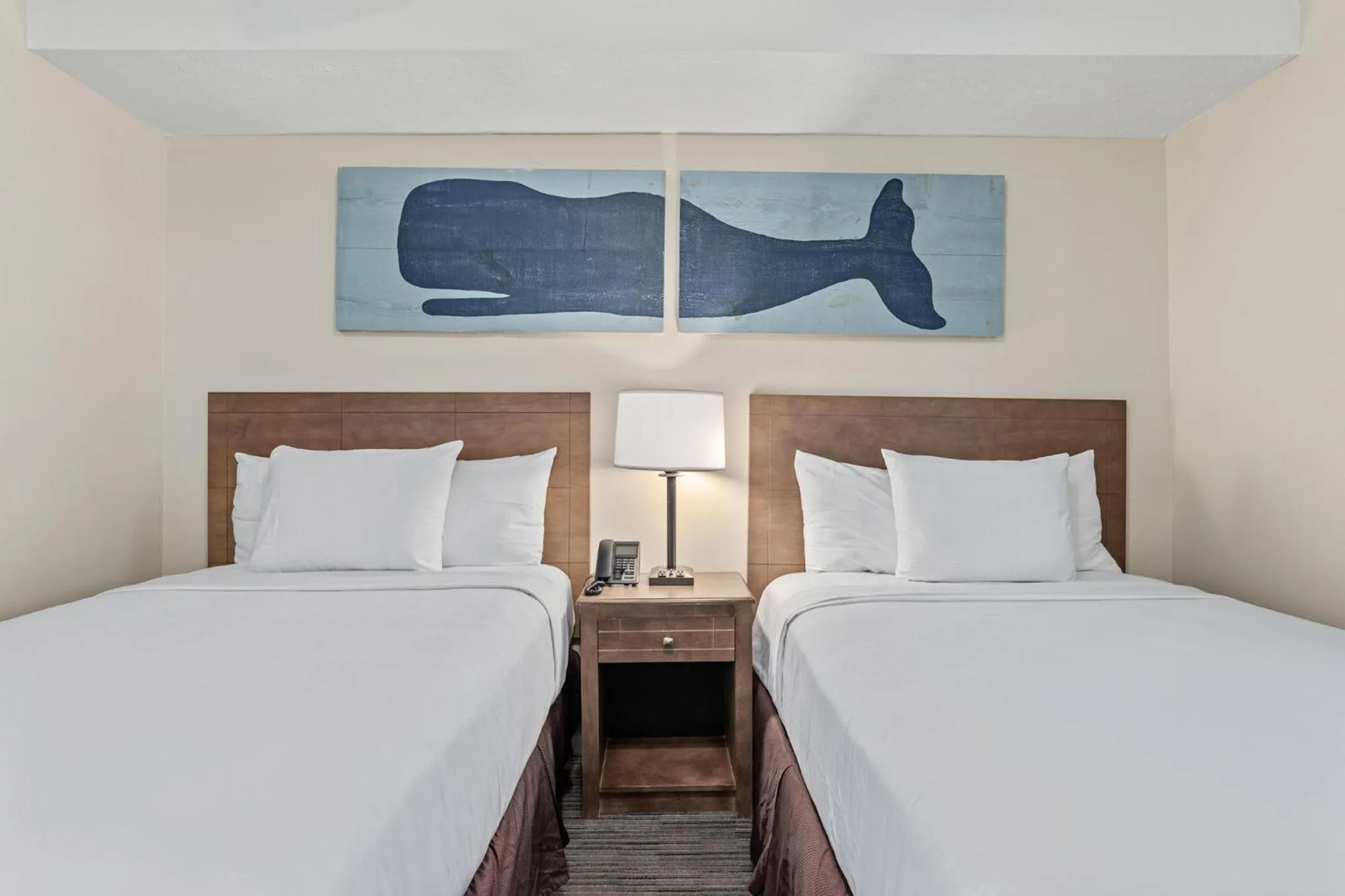 Bed in Sandpiper Beacon Beach Resort