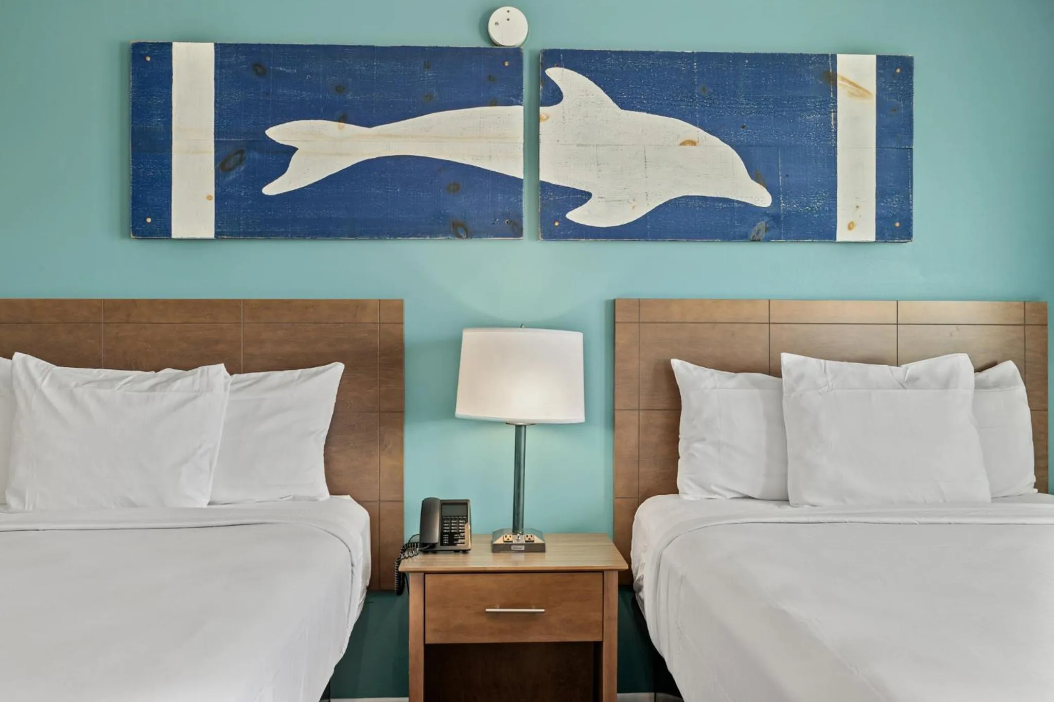 Bed in Sandpiper Beacon Beach Resort