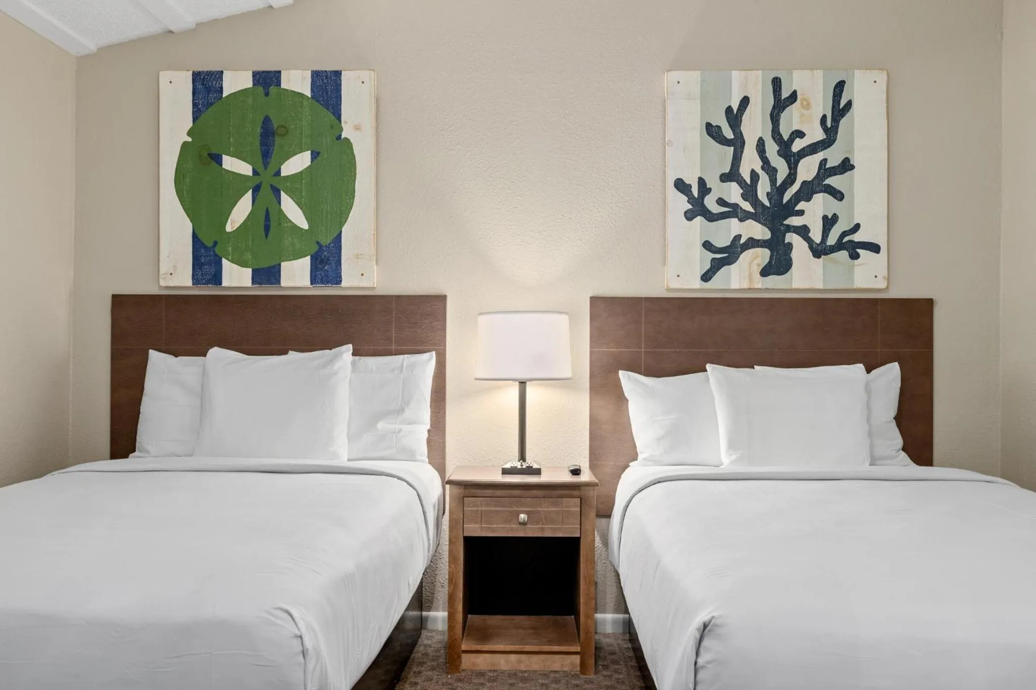 Bed in Sandpiper Beacon Beach Resort