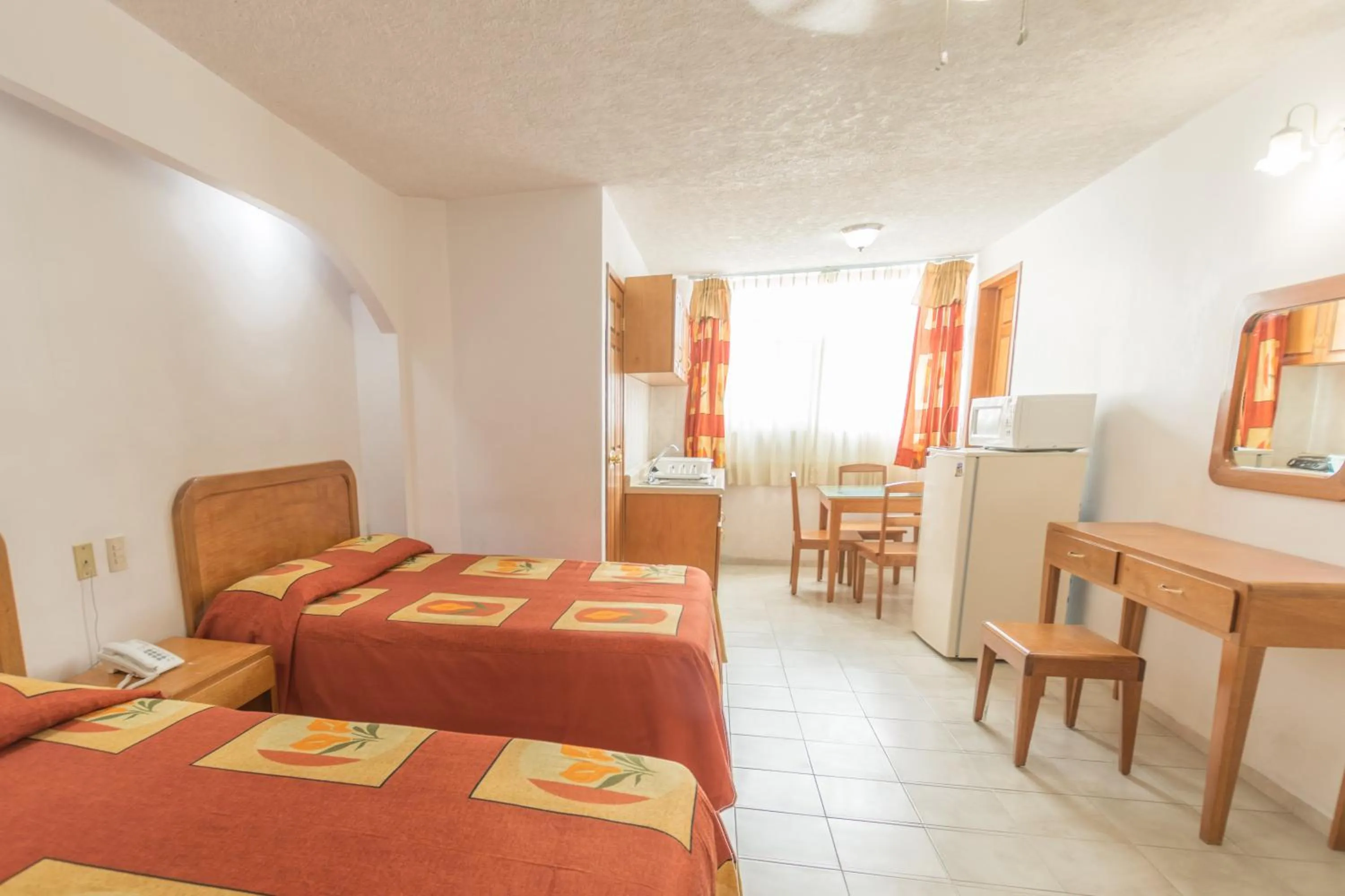 Bed in Suites Poliforum Inn