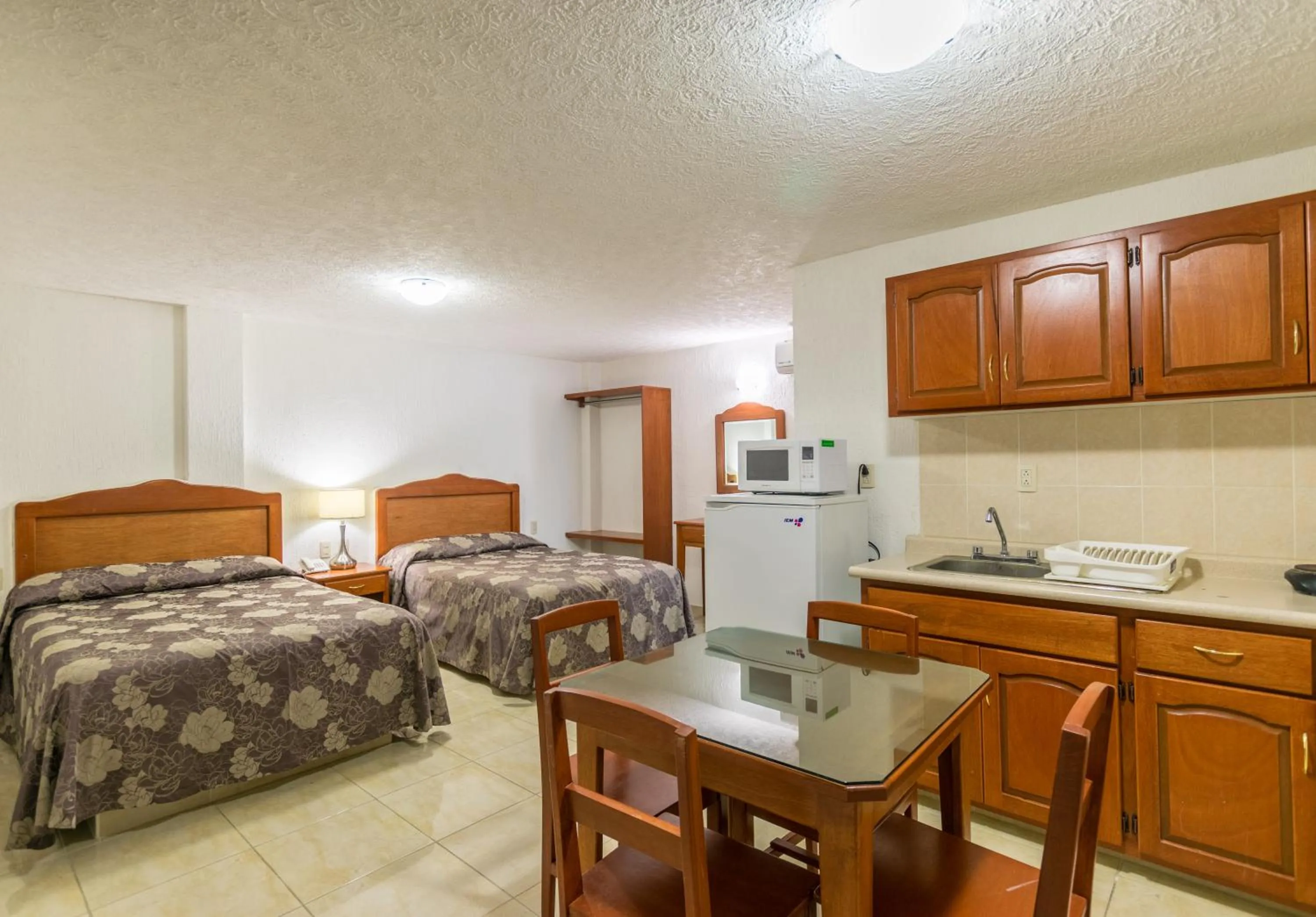 Bed in Suites Poliforum Inn