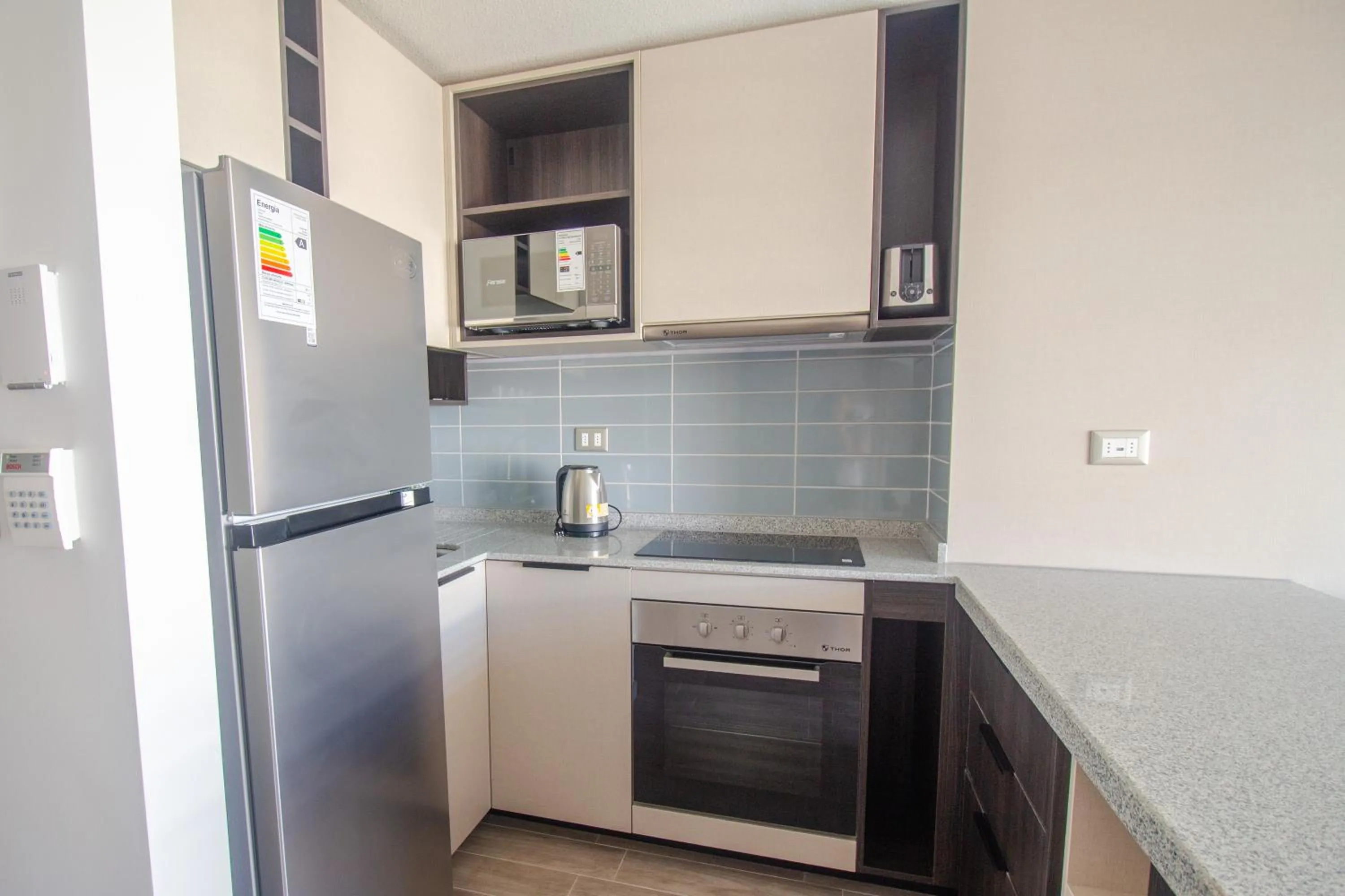 Kitchen or kitchenette in Oceana Suites Movistar Arena I Eco España