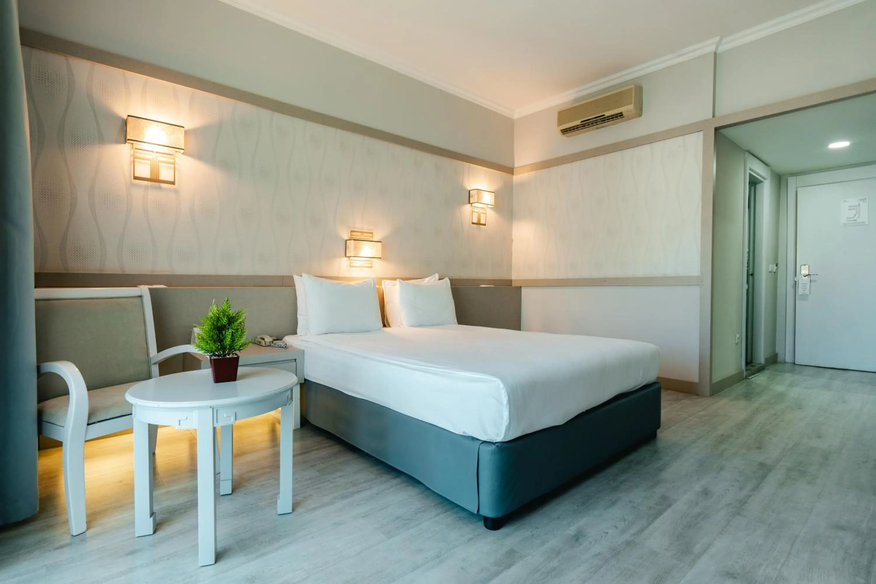 Bed in Grand Ring Hotel