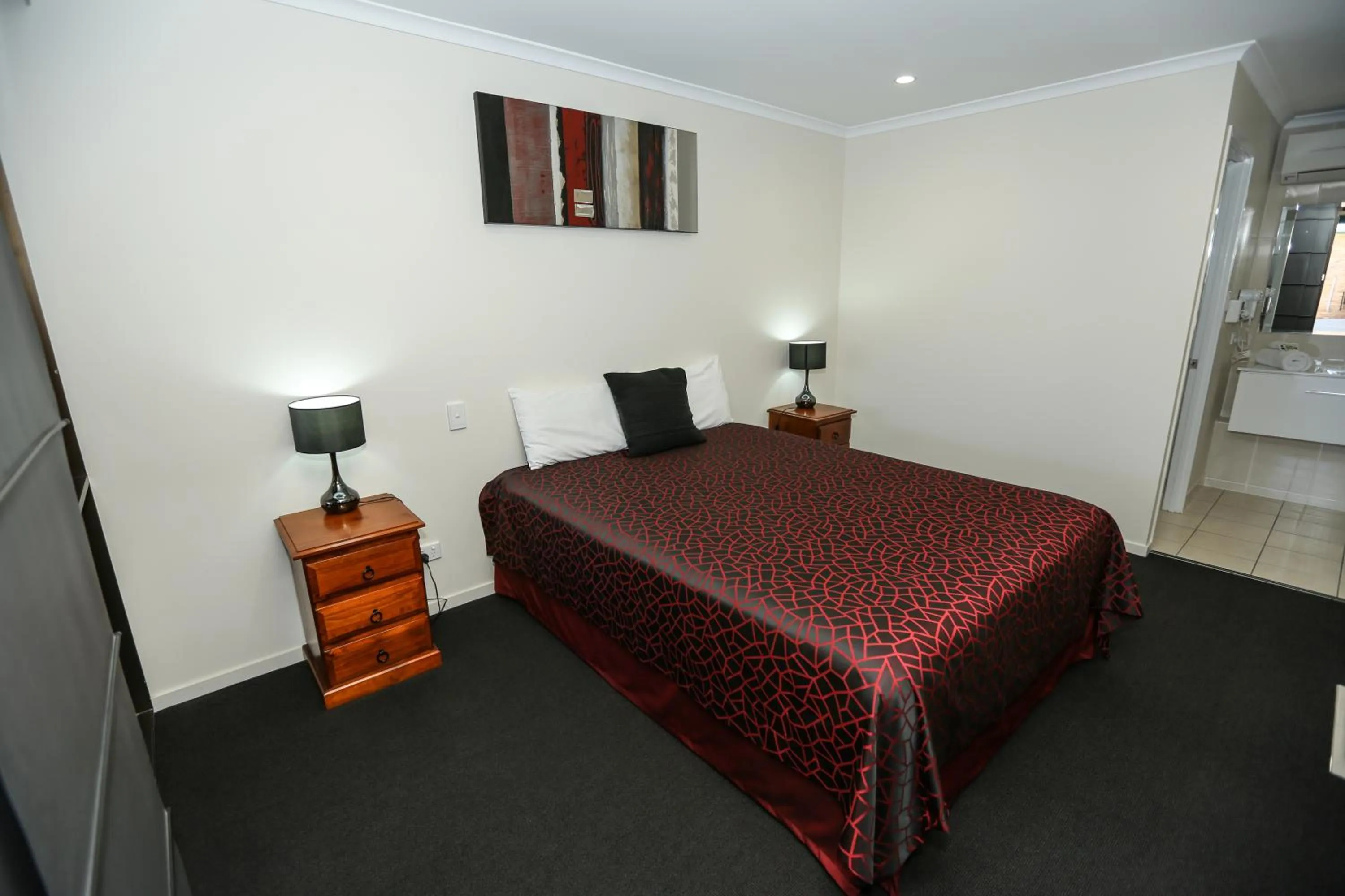 Bed in Amber Lodge Motel