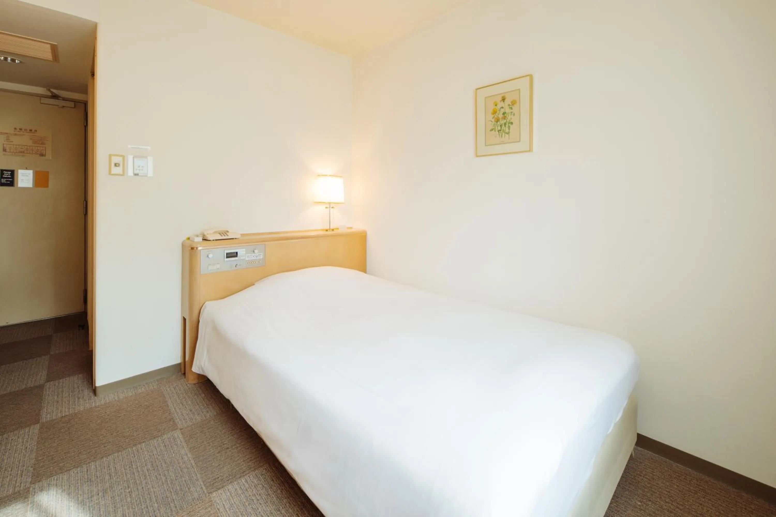 Photo of the whole room, Bed in Nest Hotel Matsuyama