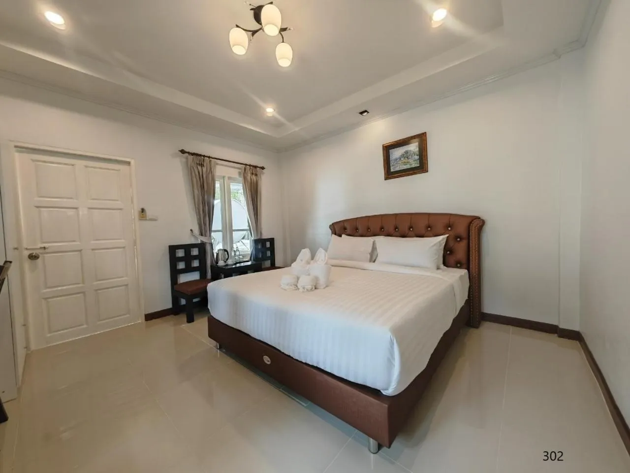 Bed in Kenikar Raintree Residence Hotel