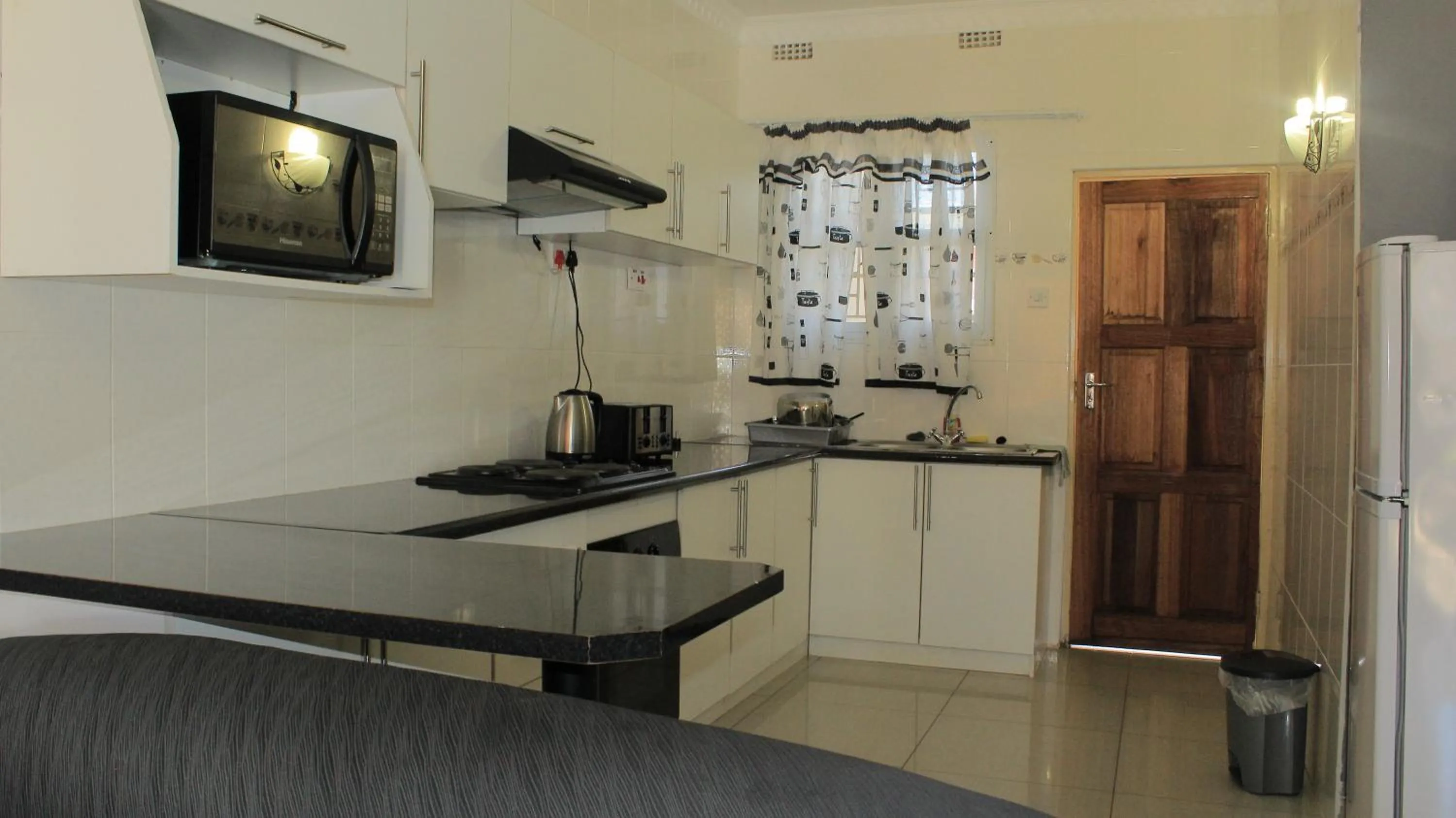 Kitchen or kitchenette in Asante Apartments