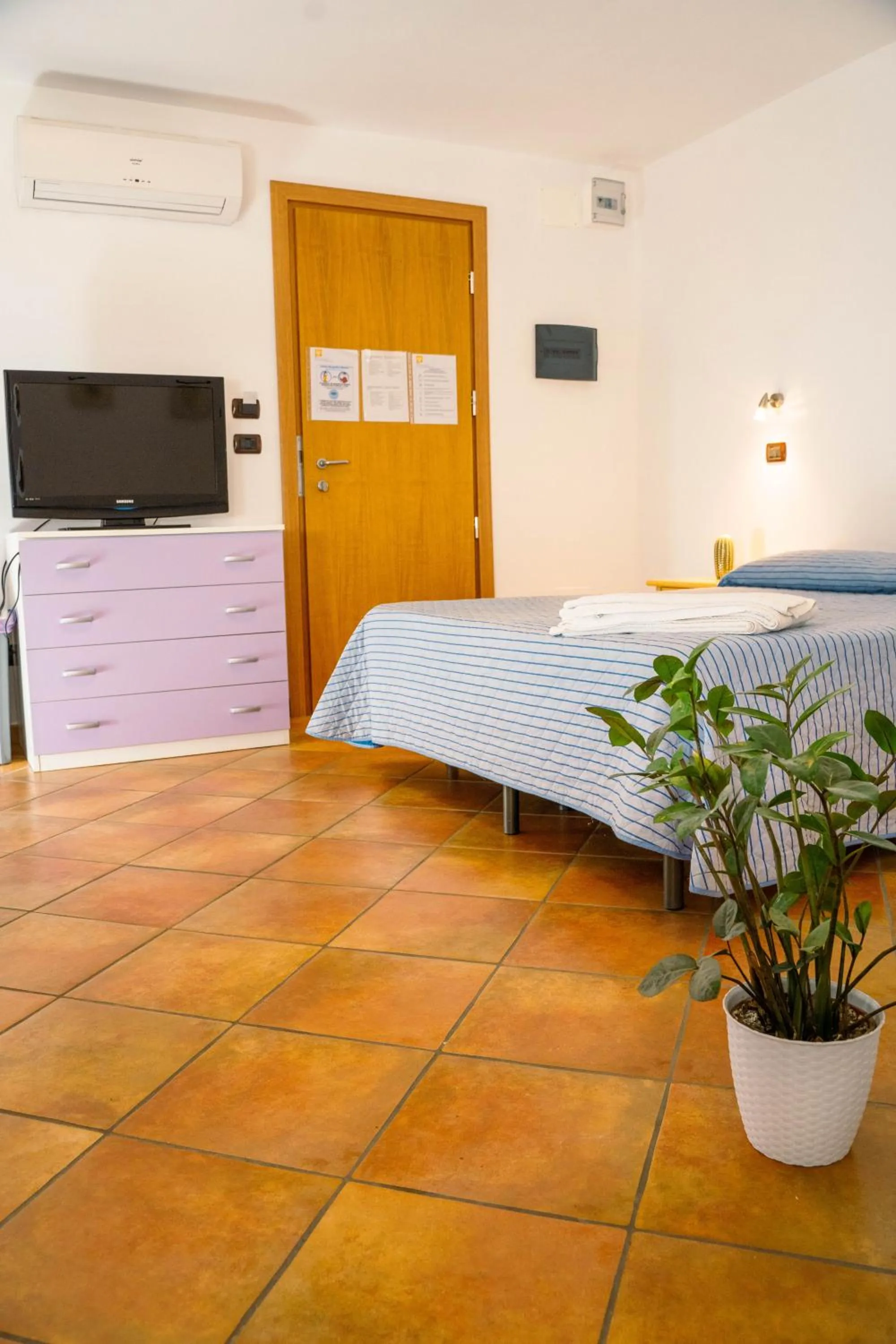 Bed in Le Tartarughe Aparthotel