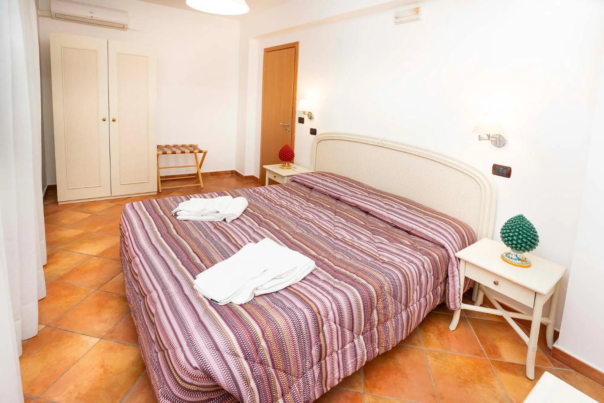 Bed in Le Tartarughe Aparthotel