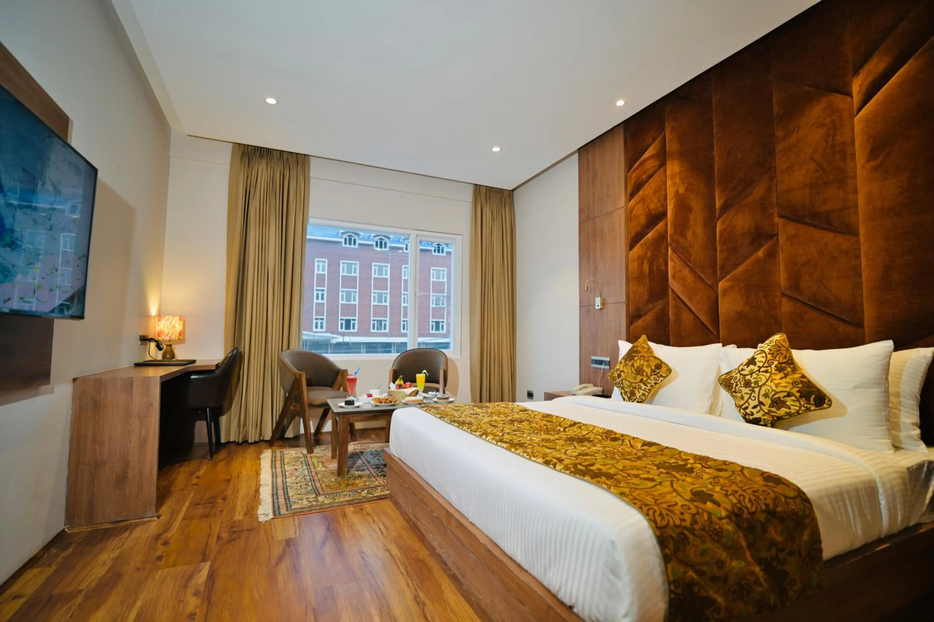 Seating area, Bed in The Olive Hotel Srinagar