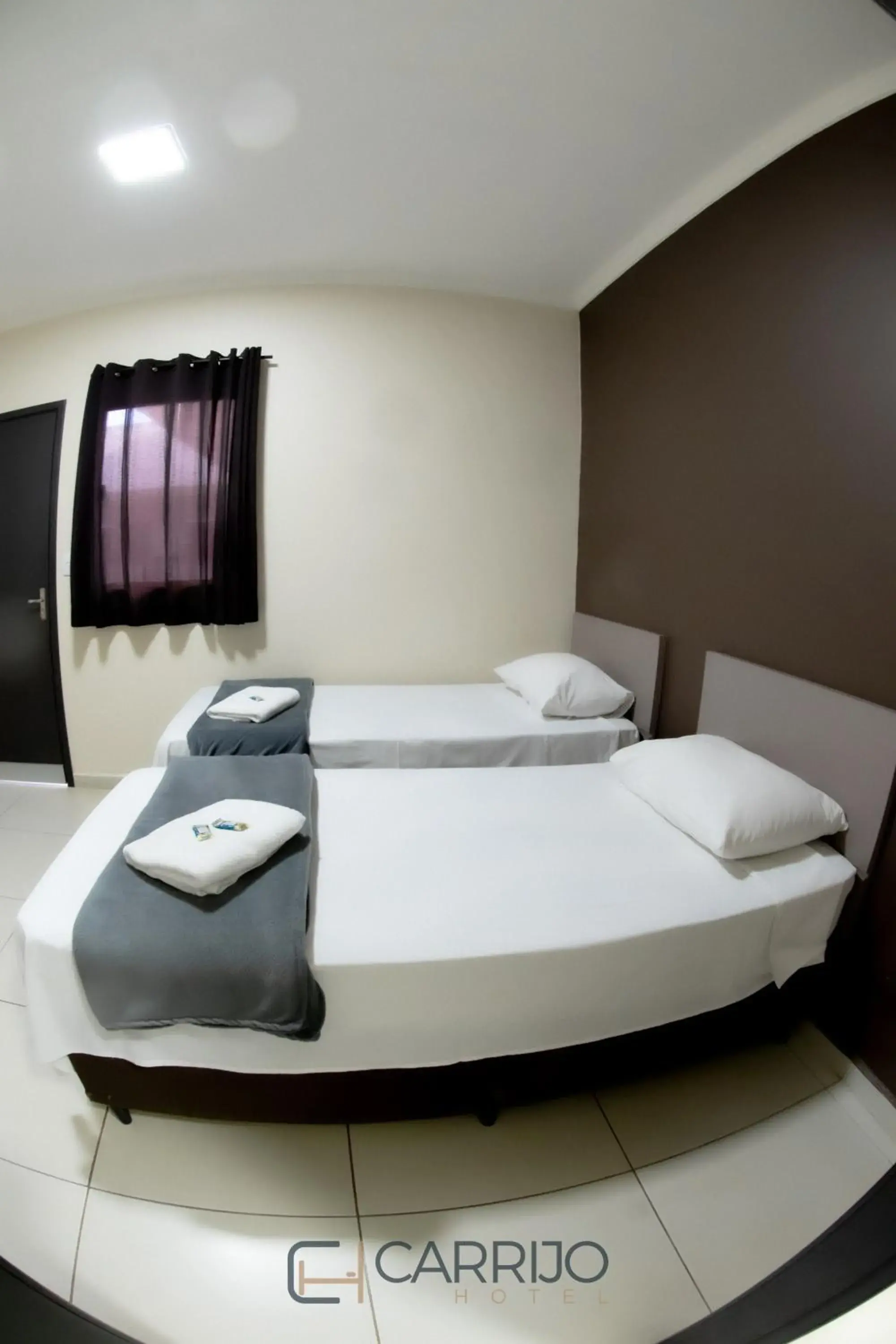 Basic Triple Room - single occupancy in Carrijo Hotel Basic Triple Room - single occupancy in Carrijo Hotel