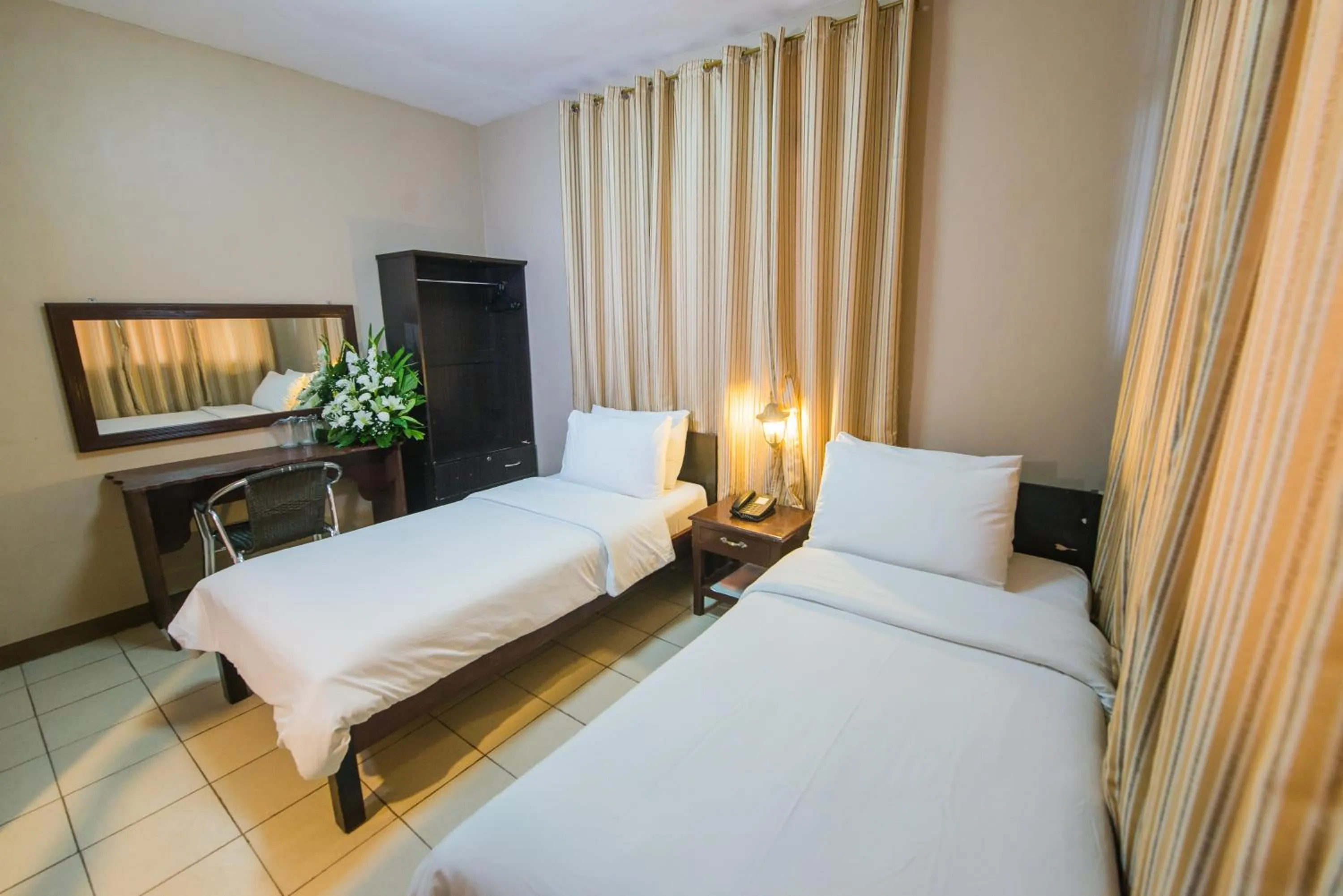 Bed in Northland Resort Hotel Manapla