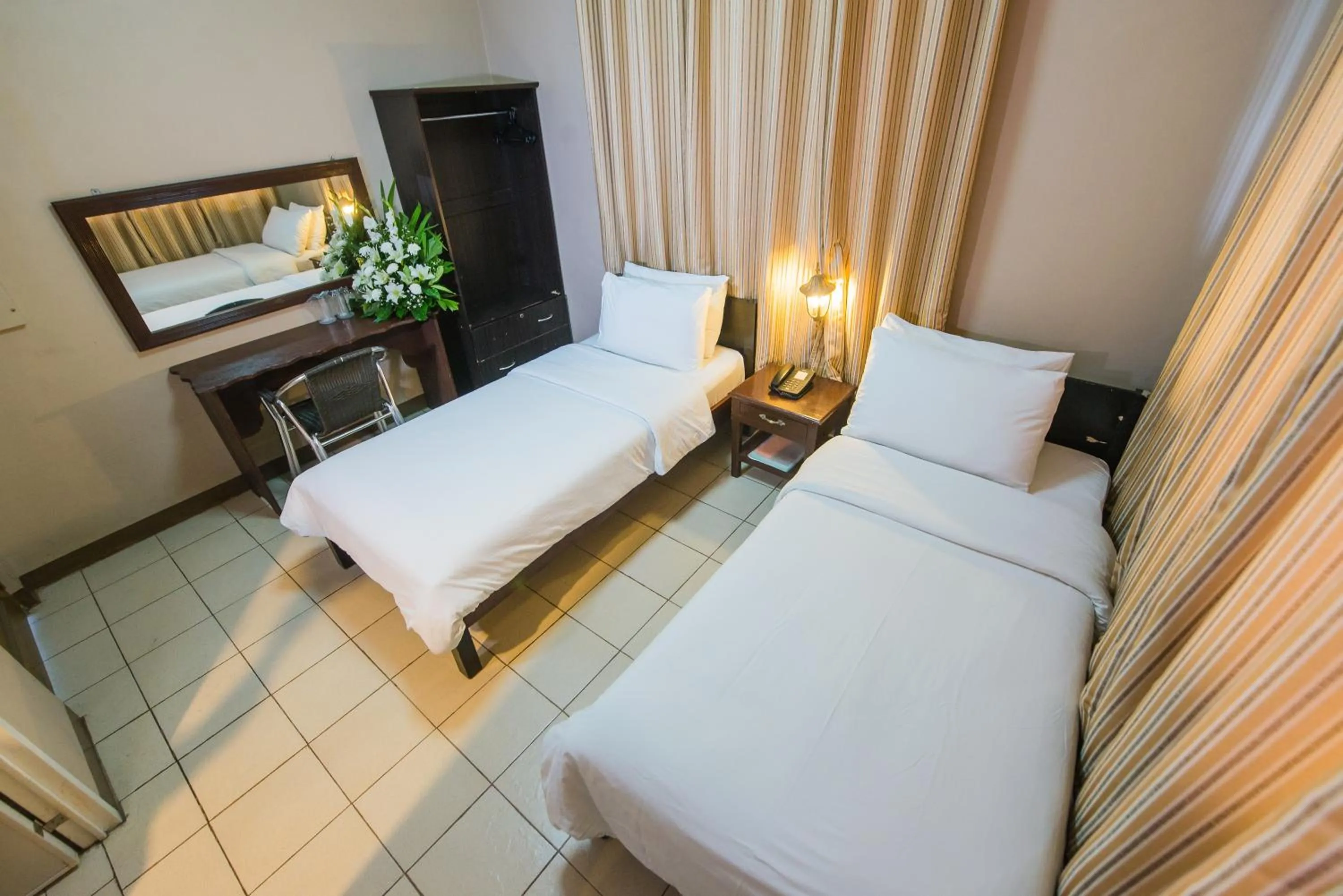 Bed in Northland Resort Hotel Manapla